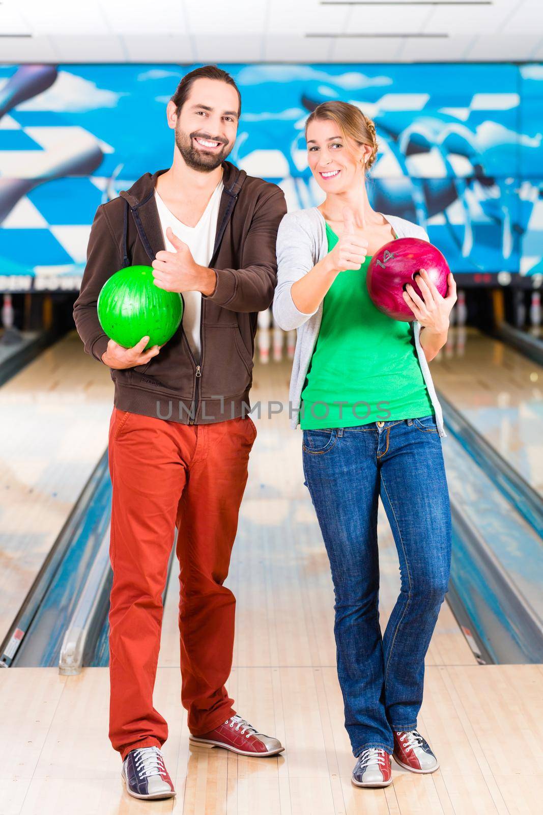 Friends playing Bowling at bowling