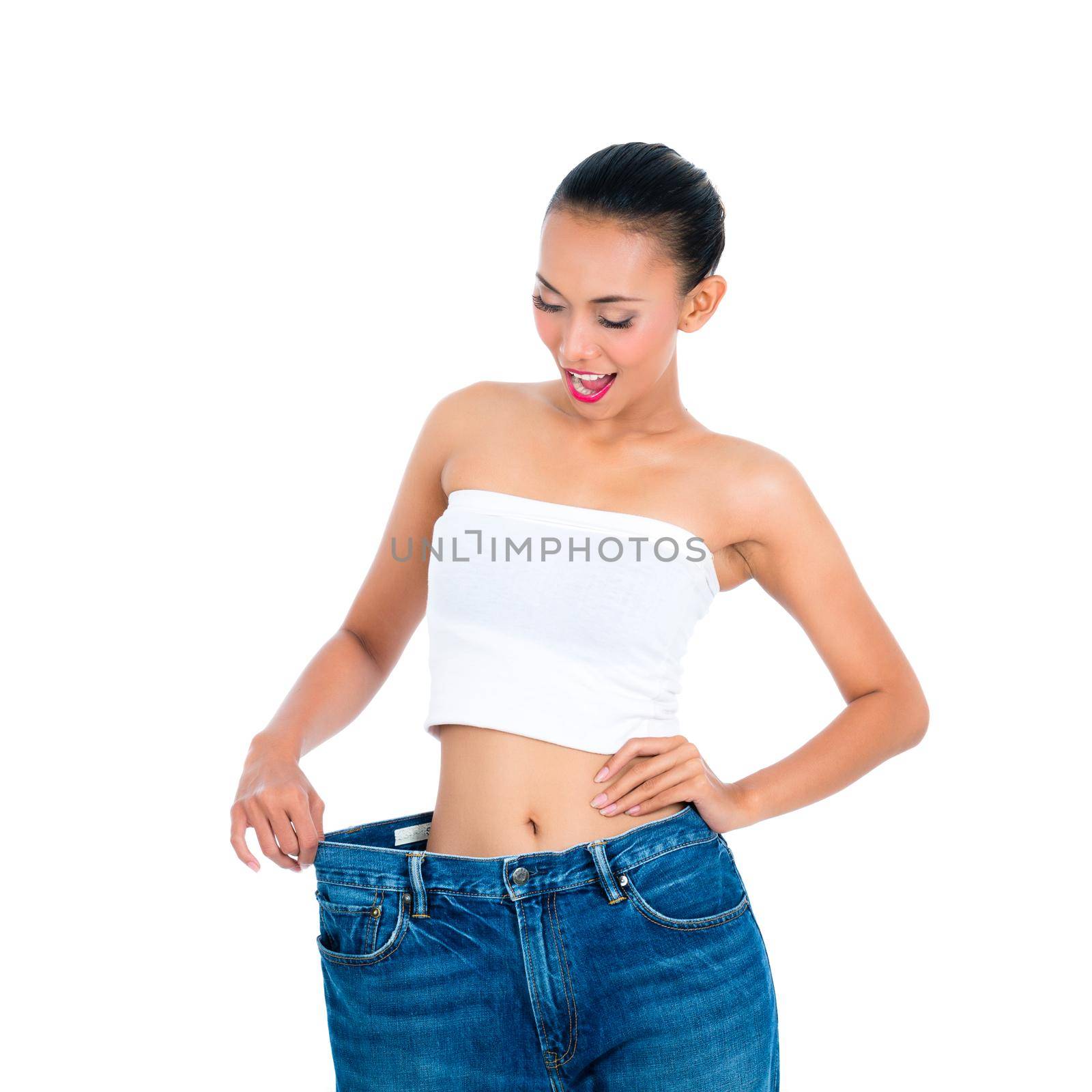 Young Asian woman losing weight by living healthy by Kzenon