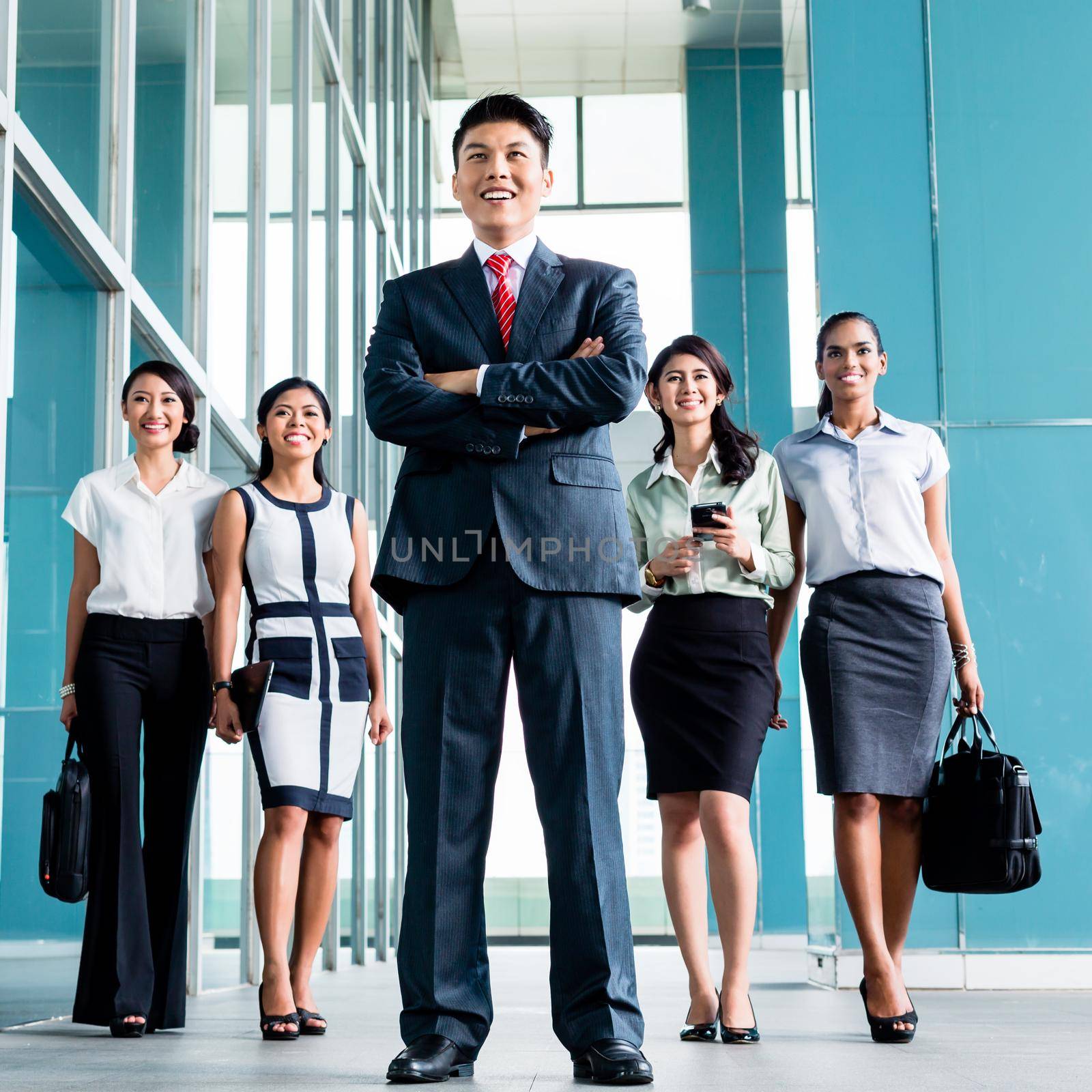 Asian business team of executives very determined to find some fault in the books they will do revision in