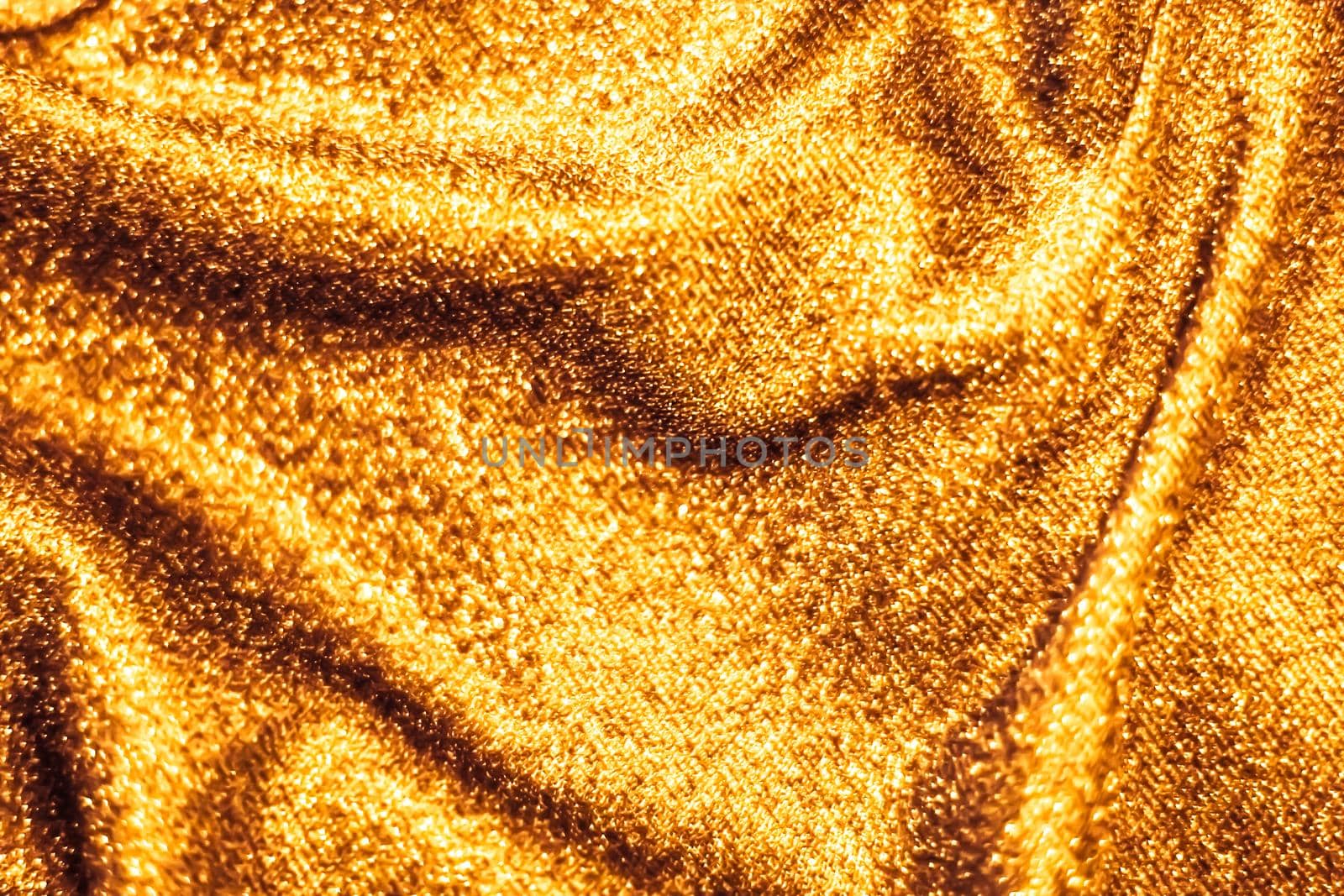 Golden holiday sparkling glitter abstract background, luxury shiny fabric material for glamour design and festive invitation by Anneleven