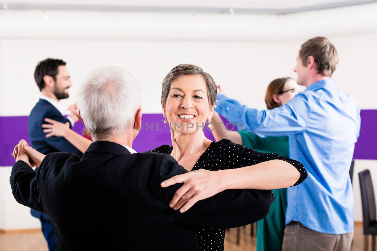 Group of people dancing in dance class having fun