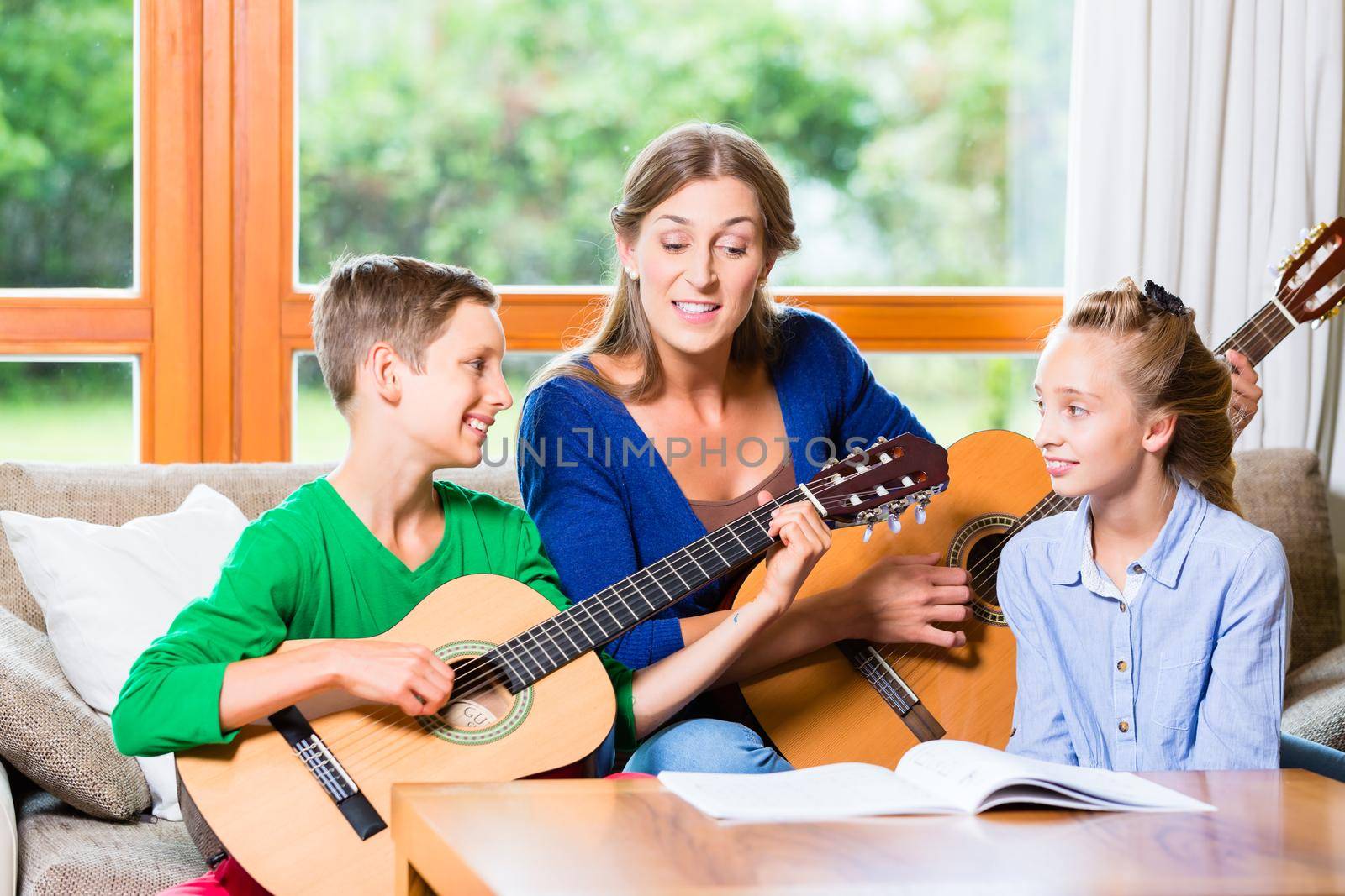 Family making music with guitar by Kzenon