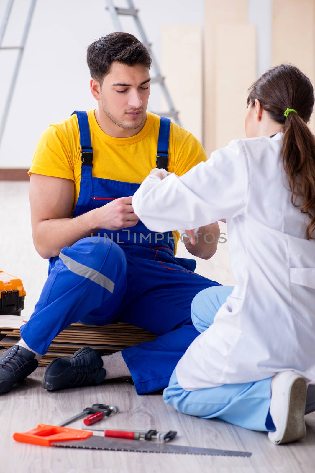 Injured worker being assisted by doctor