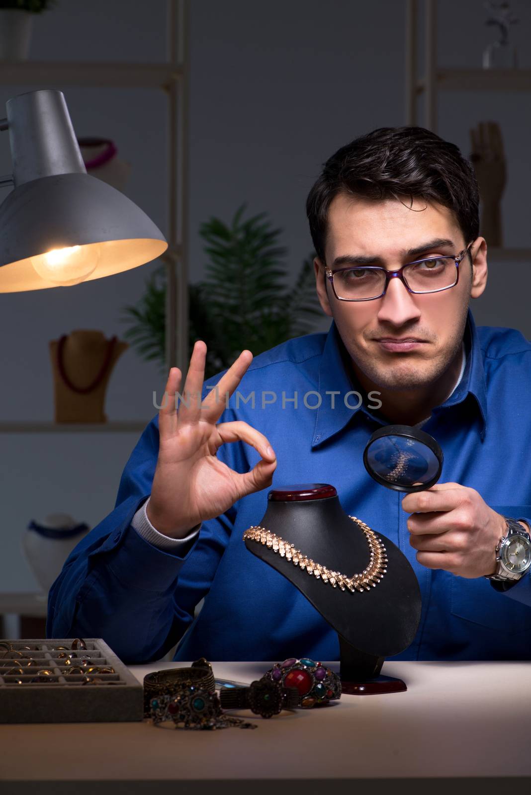 Jeweler working in his workshop late at night