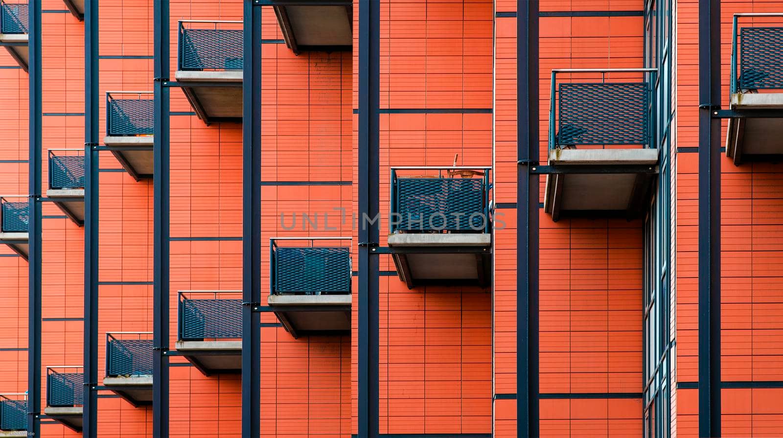 Building with many balconies, Pattern of the facade of a building, Balconies. Geometry minimalist art red