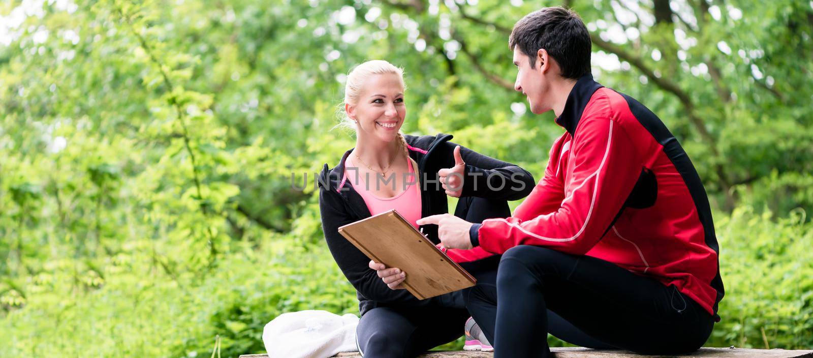 Woman with personal trainer at running evaluation by Kzenon