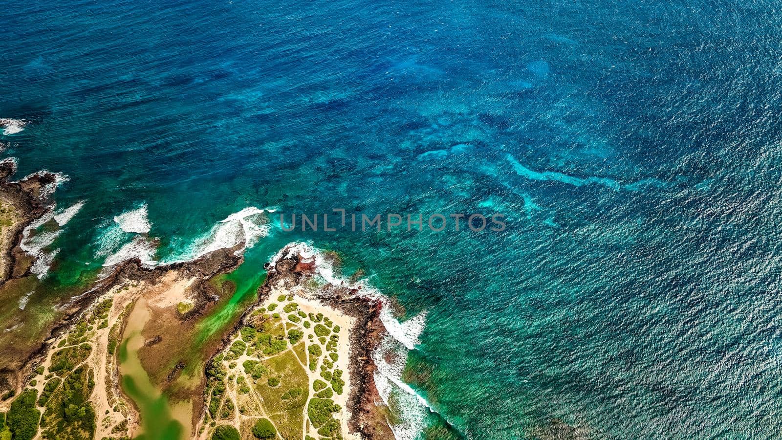 Aerial view of ocean waves and fantastic rocky shoreline, Aerial view of a coastline along Great Ocean Road, Aerial view of waves hitting rocks on beach with turquoise water