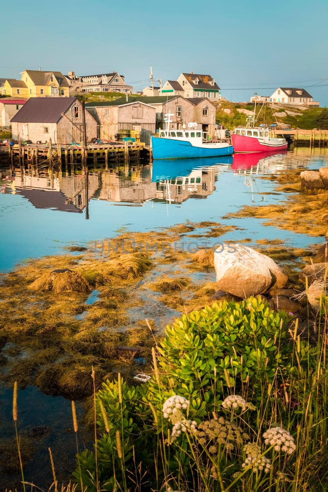 Wooden fishing huts Sweden, Scandinavia, 2 boats near wooden houses in the countryside, two boats in the water near wooden huts