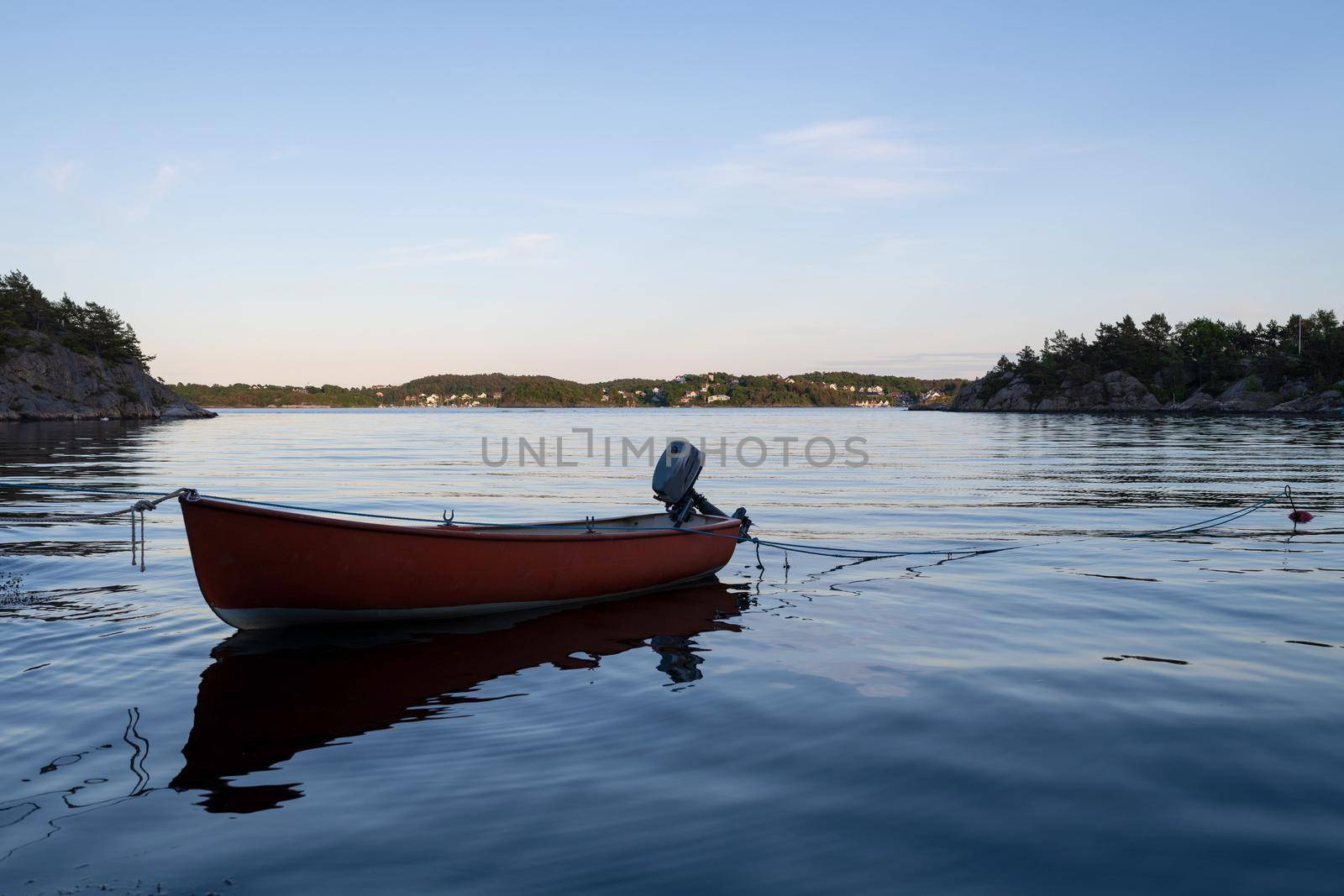 Small wooden boat in the middle of a lake, Lonely wooden boat in the water, isolated wooden boat, Top view of a white small wooden boat floating in the middle of a lake by isaiphoto