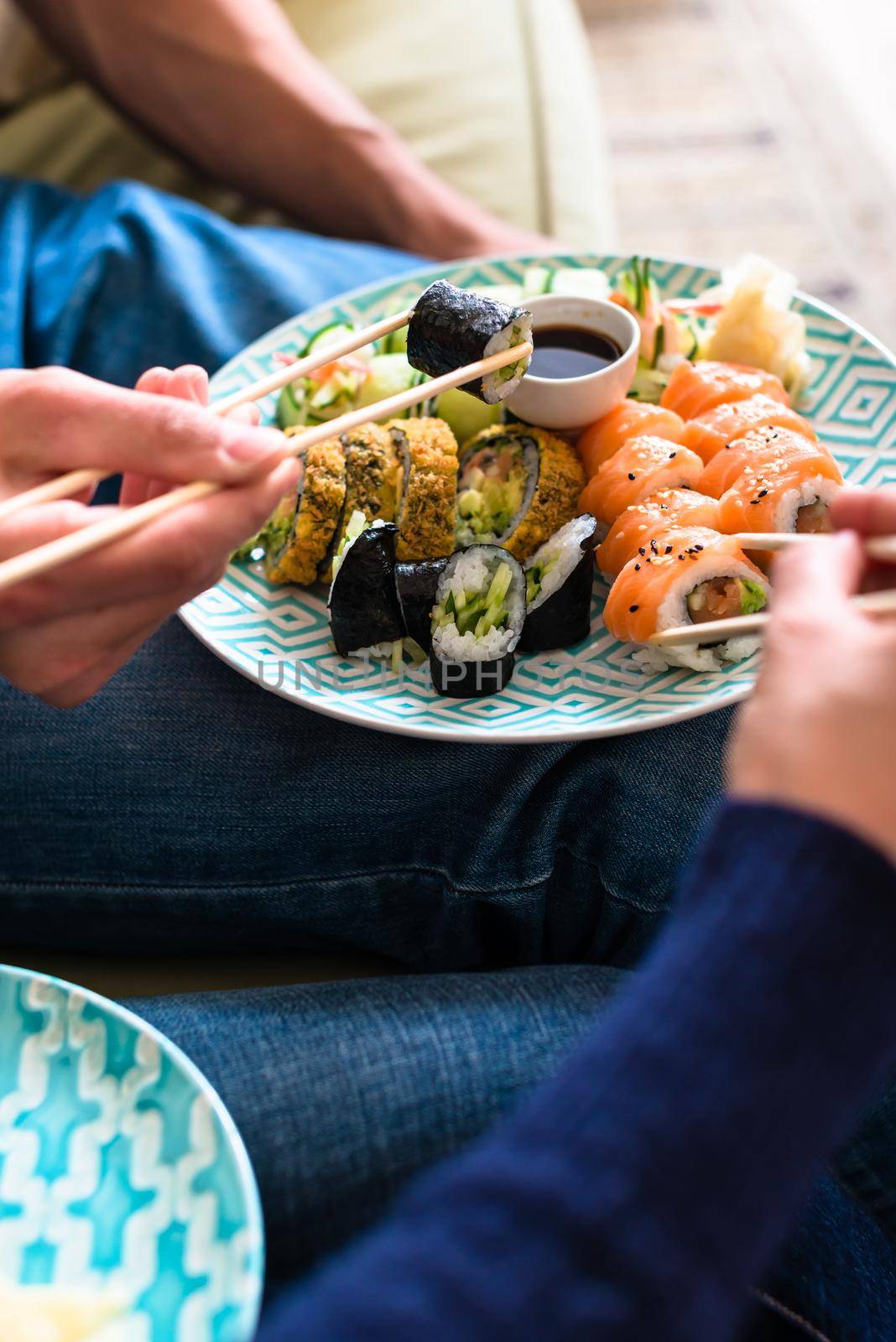 Close-up of traditional Japanese food during romantic dinner at home by Kzenon