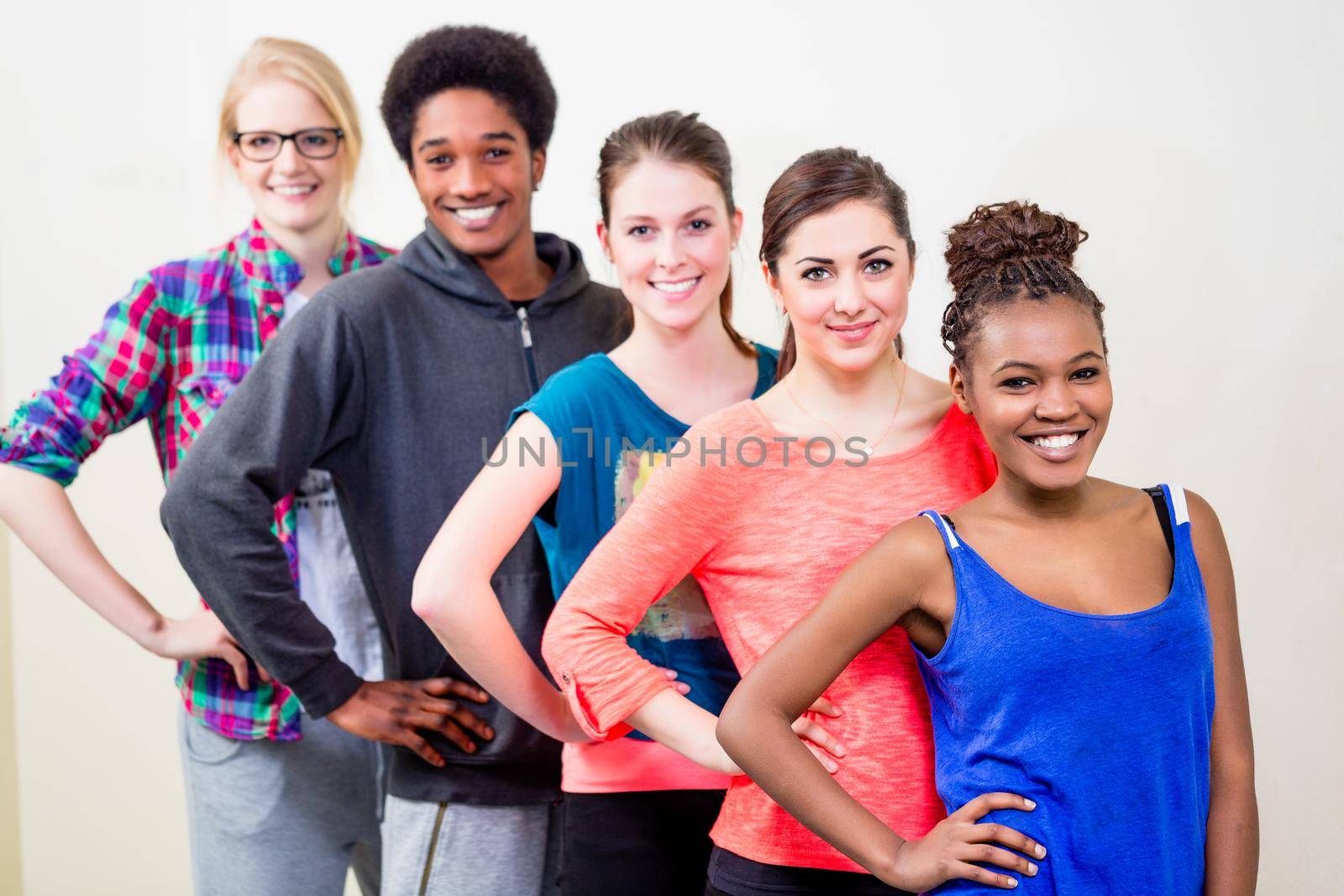 Group of young people having dance lessons