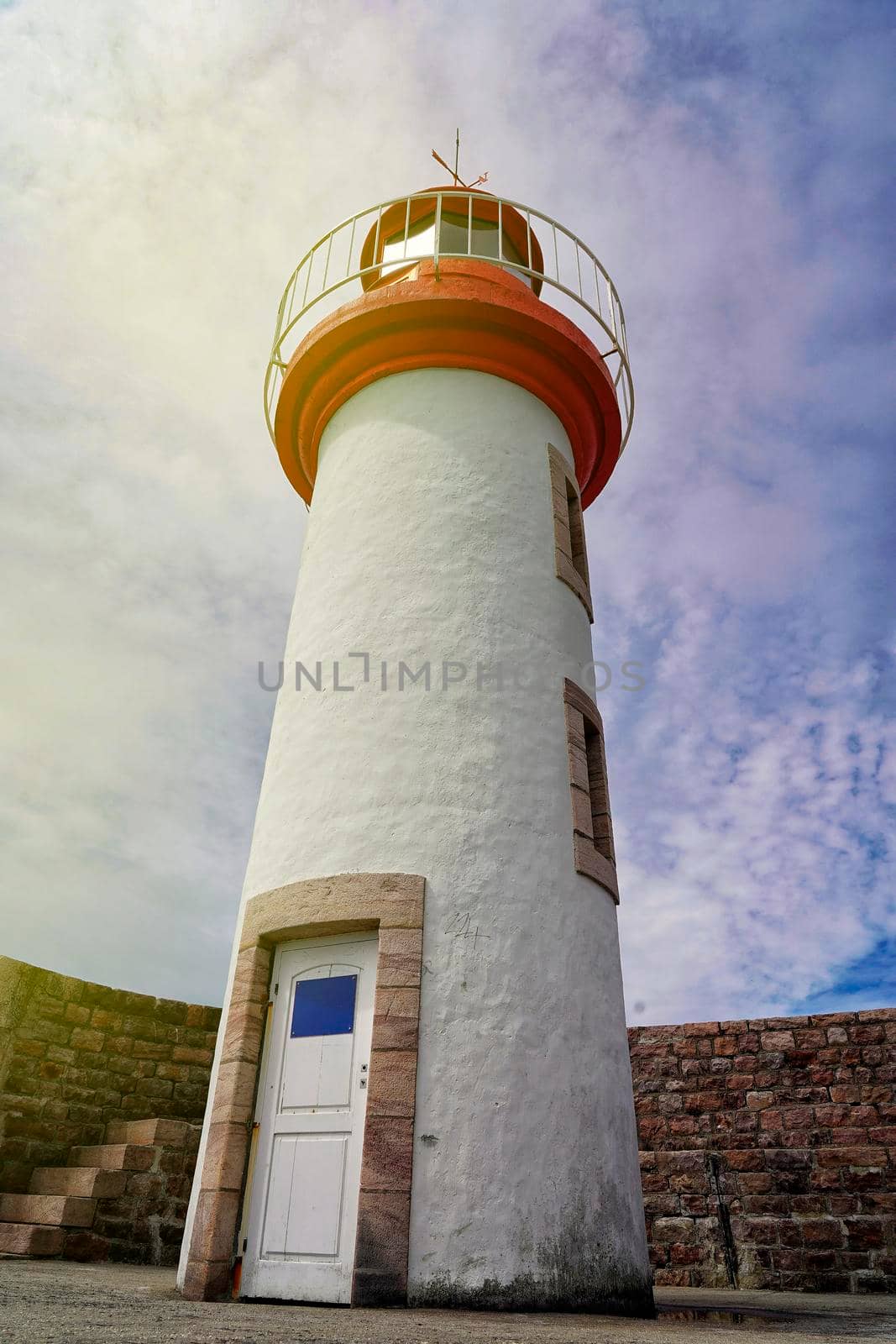Architectural image of a lighthouse with blue sky