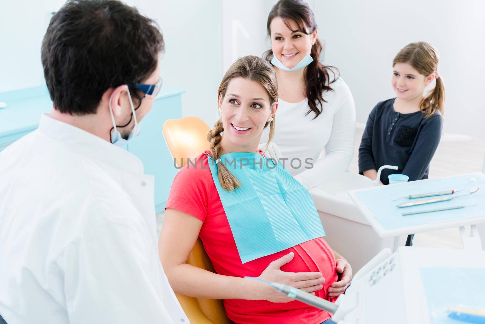 Pregnant woman at dentist before treatment by Kzenon