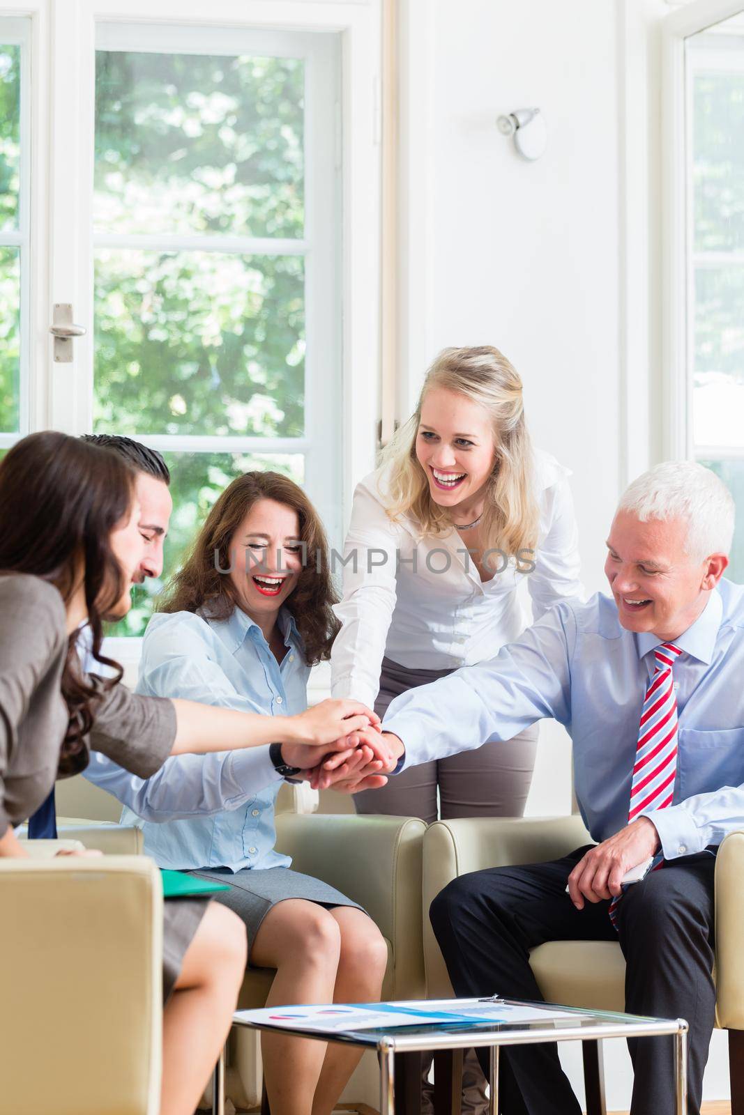 Business Team getting motivation for better work stacking hands