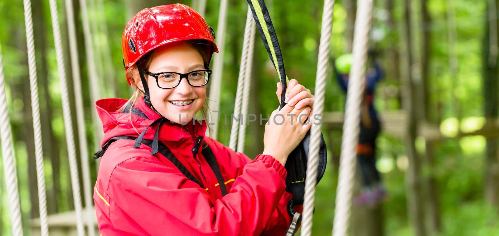Girl roping up in high rope course by Kzenon