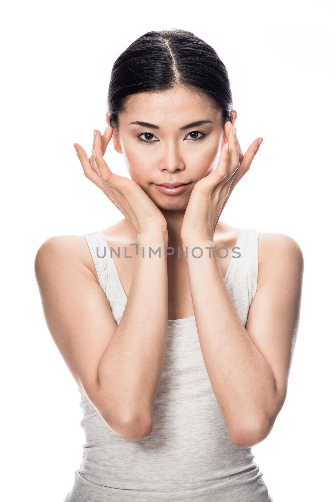 Portrait of Asian young woman looking at camera by Kzenon