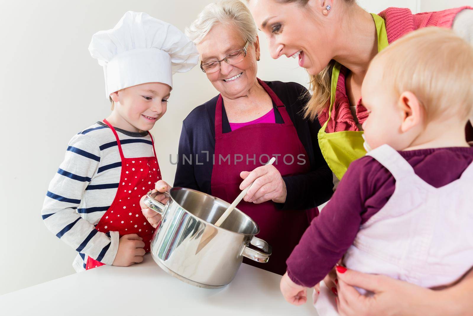 Happy family cooking in multigenerational household