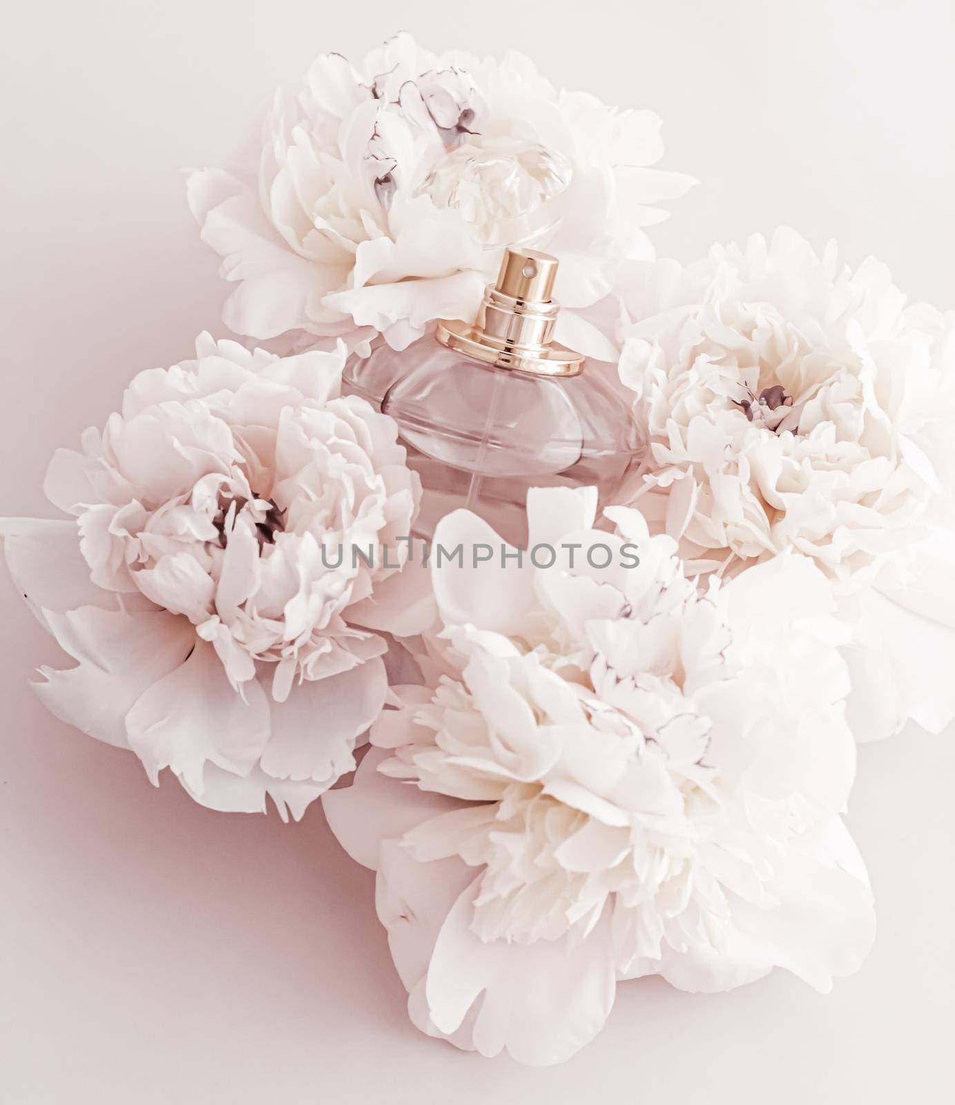 Fragrance bottle as luxury perfume product on background of peony flowers, parfum ad and beauty branding by Anneleven