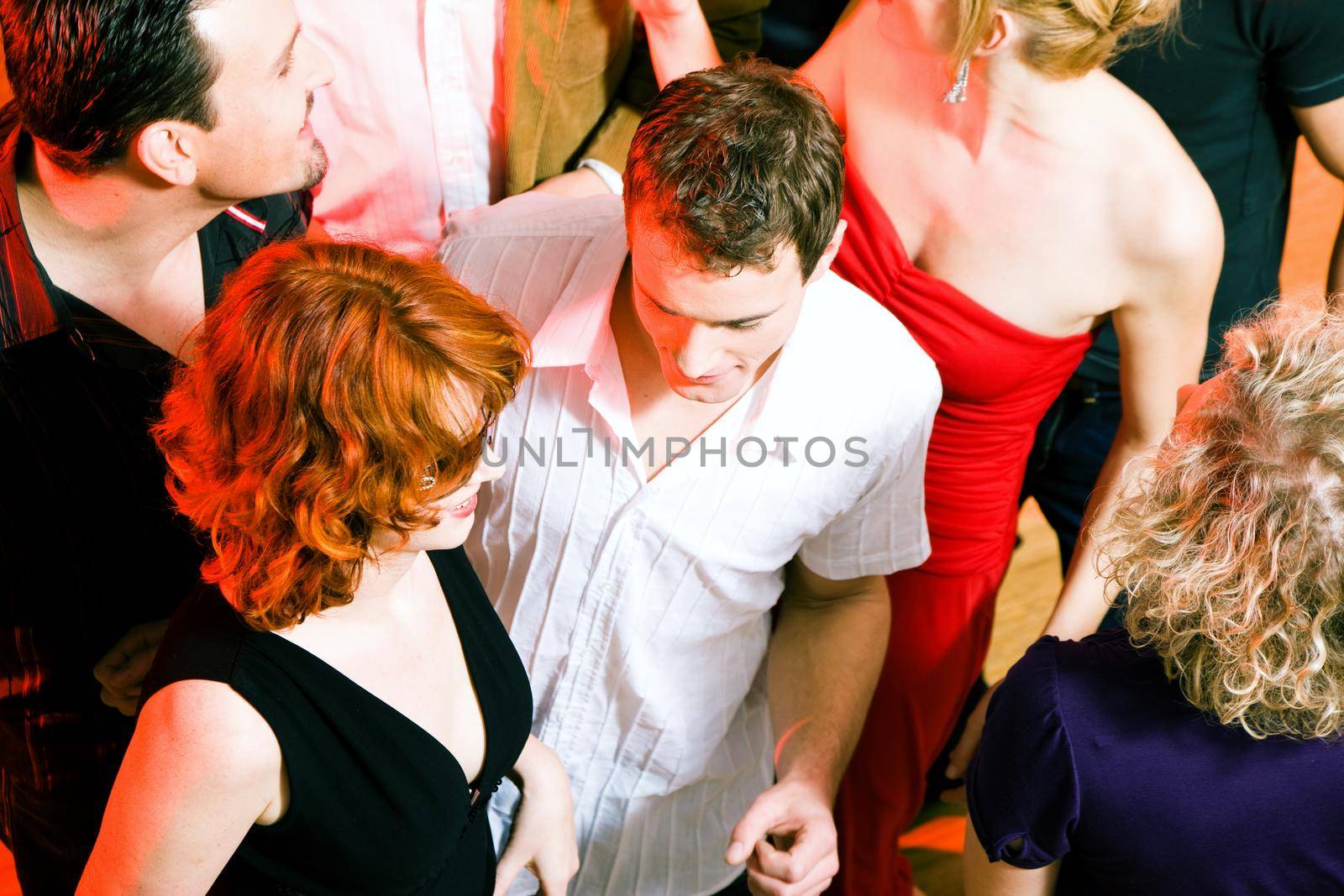 People dancing in a club by Kzenon