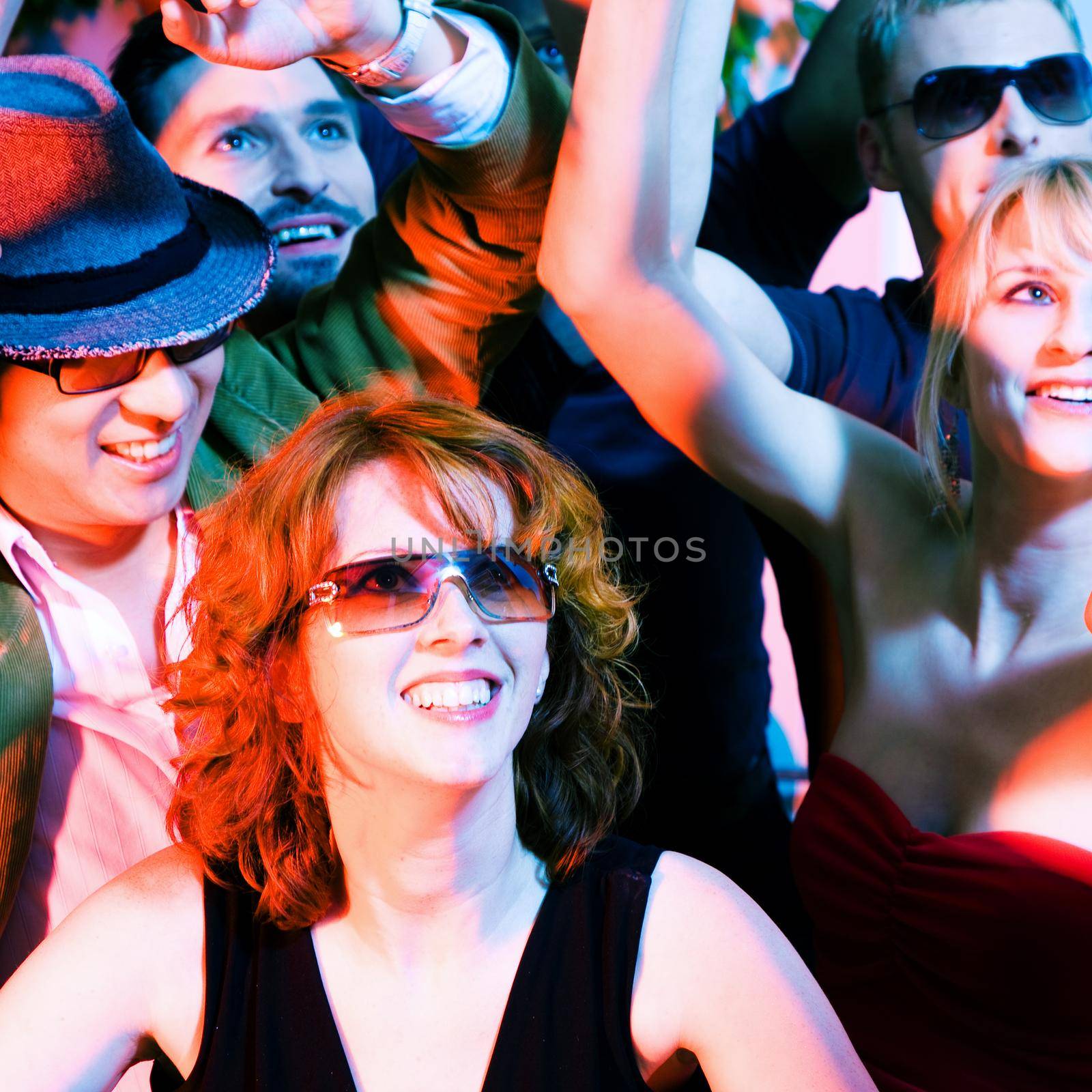 Cheering crowd in disco club by Kzenon