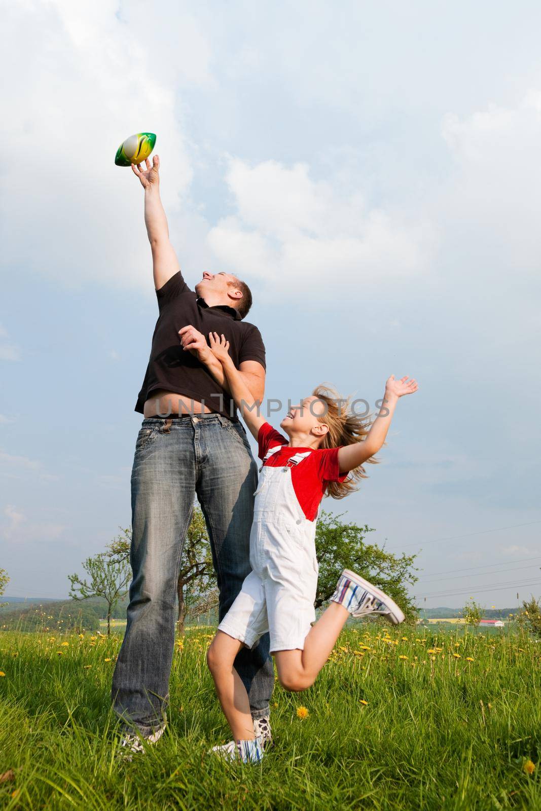 Father and daughter catching the ball by Kzenon