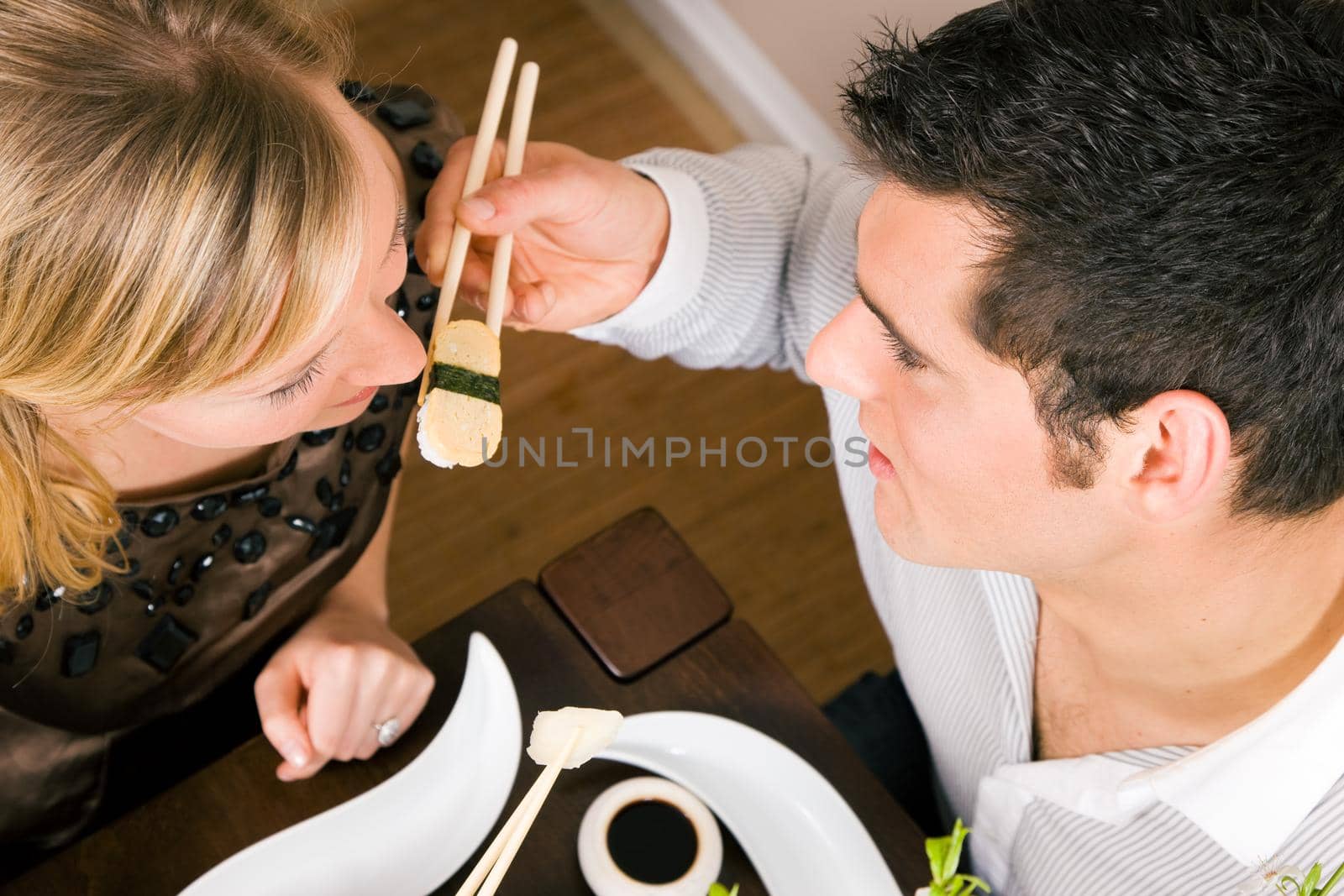 Couple eating Sushi by Kzenon