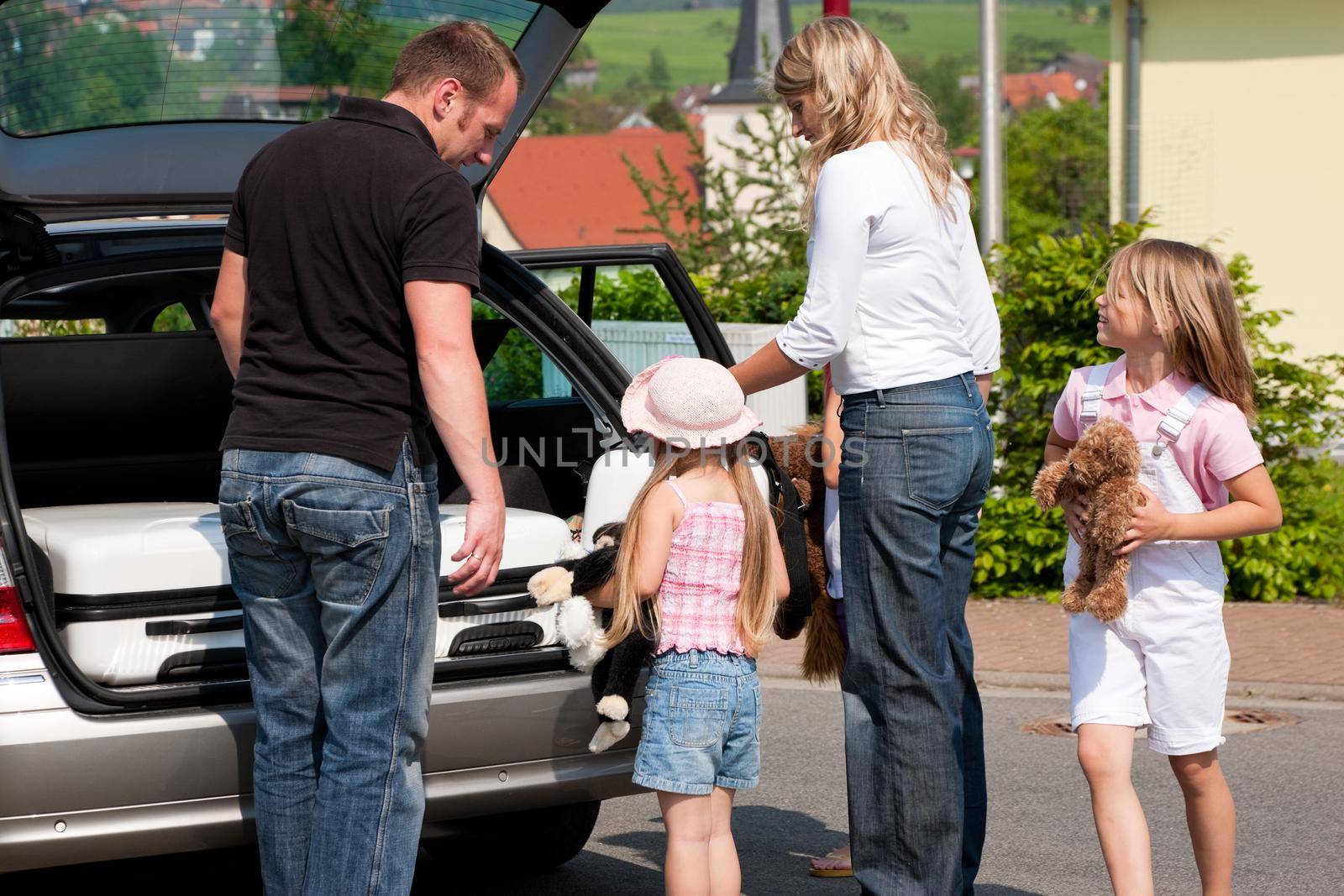 Family travelling by car by Kzenon