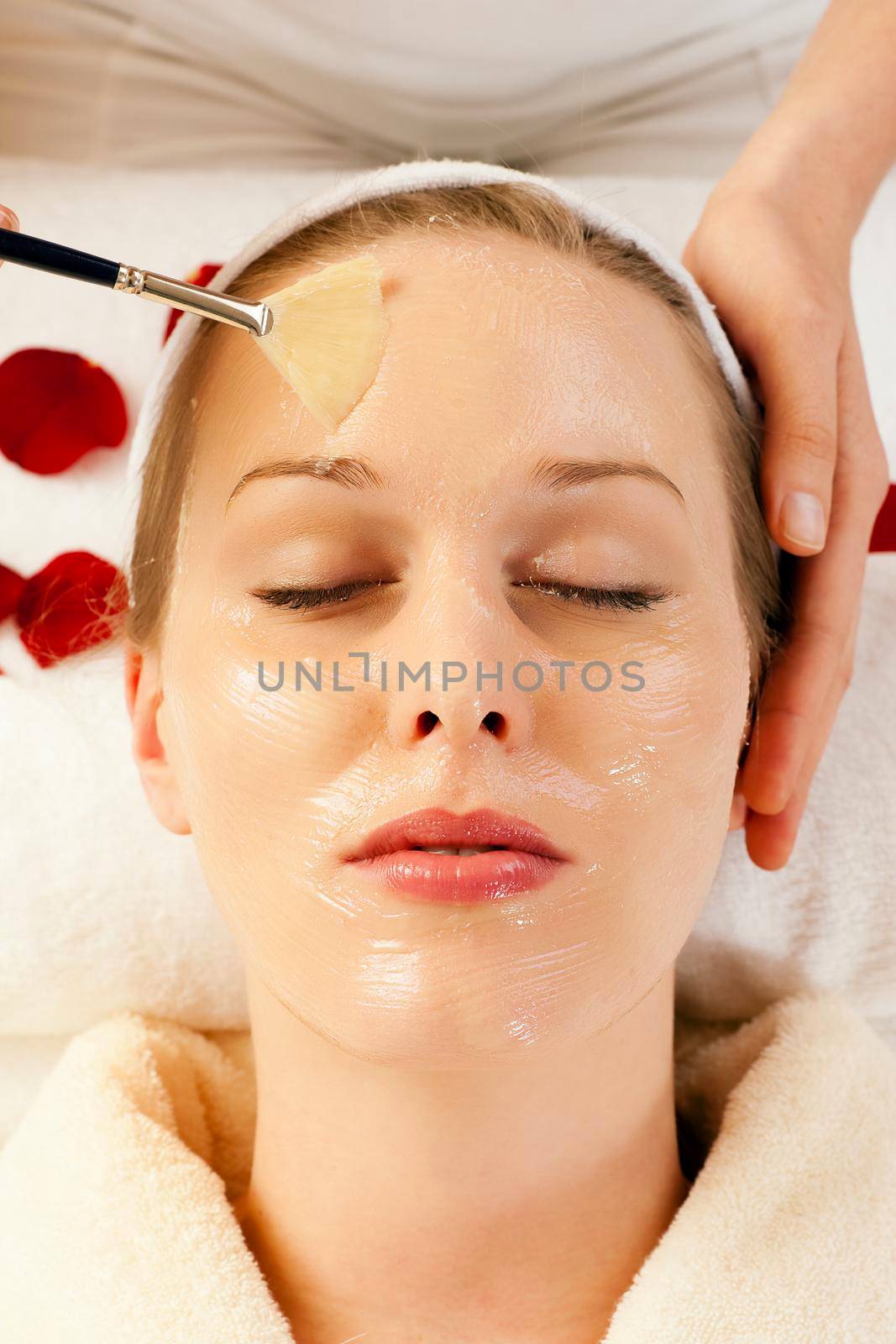 Woman having a mask or cream applied in the course of a beauty treatment