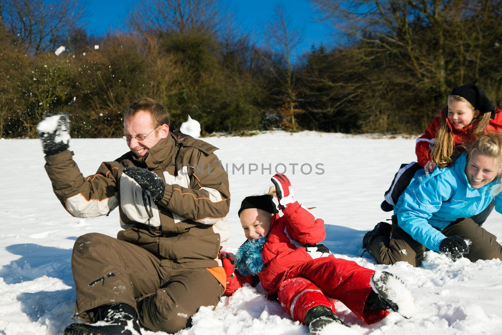 Family having a snowball fight by Kzenon