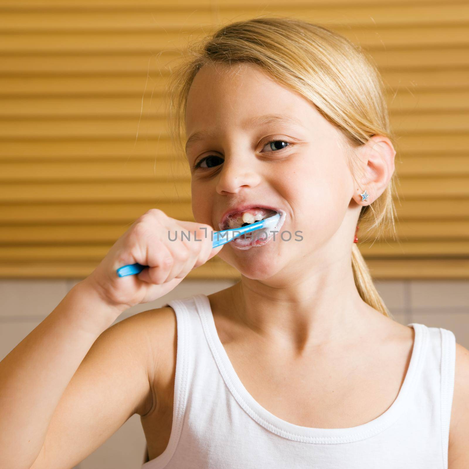 Child brushing teeth by Kzenon