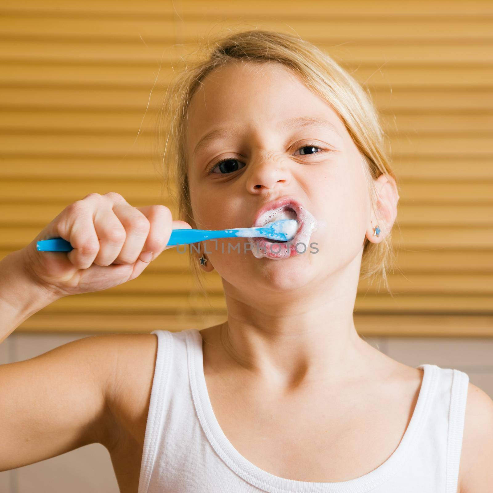 Child brushing teeth by Kzenon