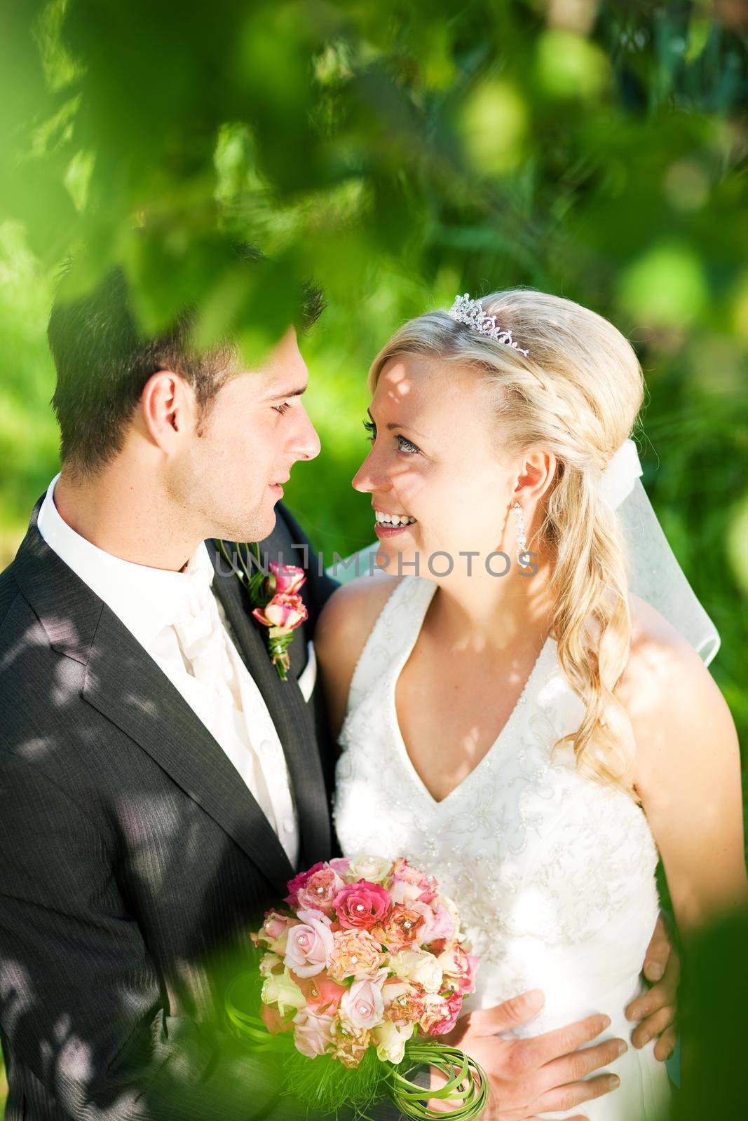 Wedding couple in romantic setting by Kzenon