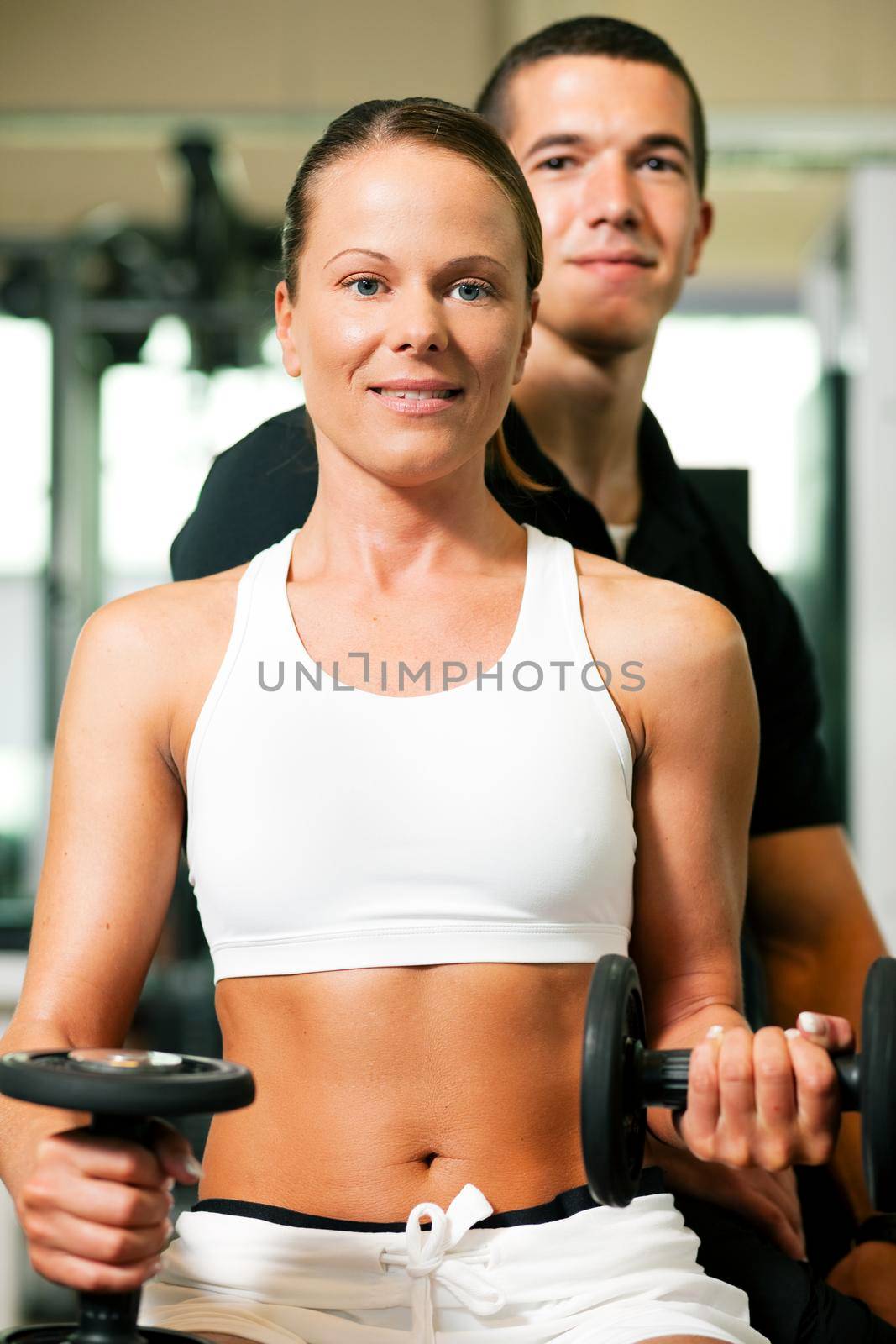 Personal Trainer in gym by Kzenon