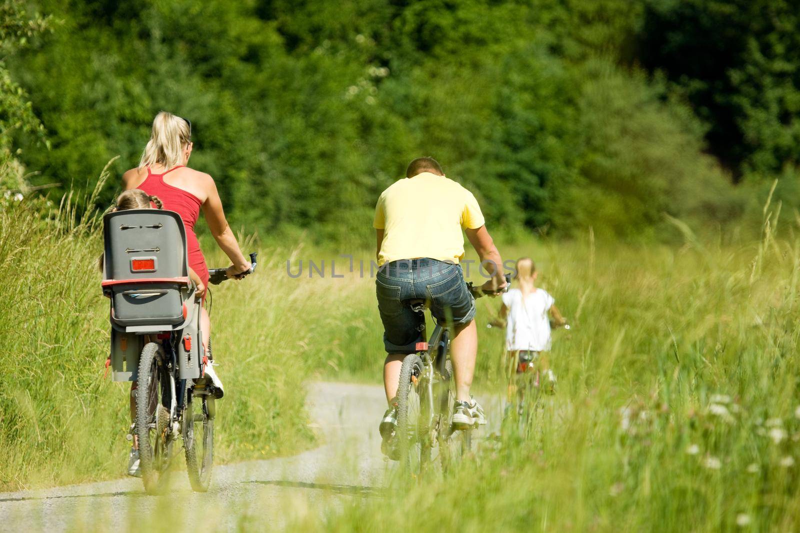 Family rides the bike by Kzenon