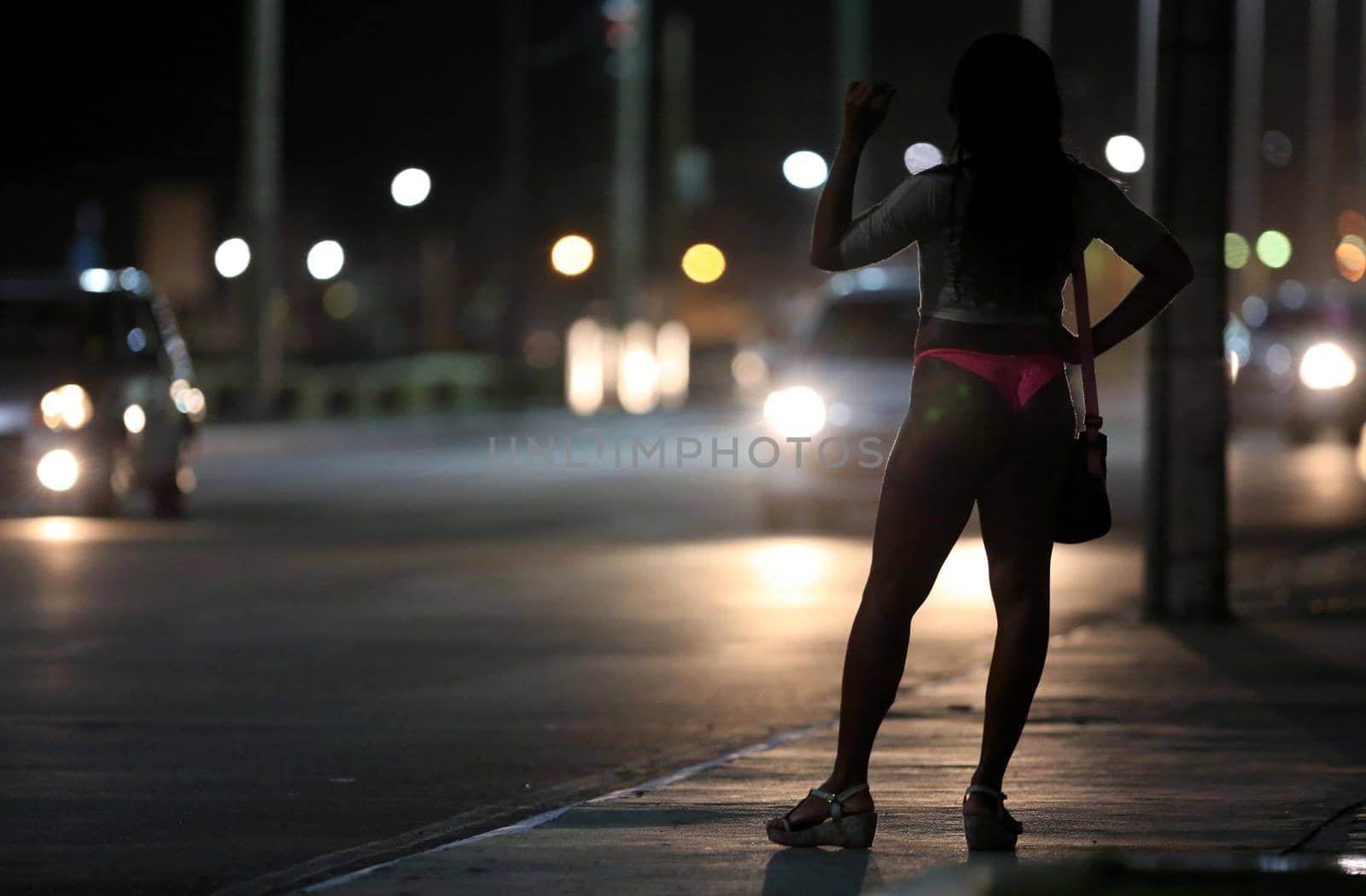 salvador, bahia / brazil - october 5, 2015: a transvestite who acts as a prostitute is seen on the street in the Pituba neighborhood in the city of Salvador.
