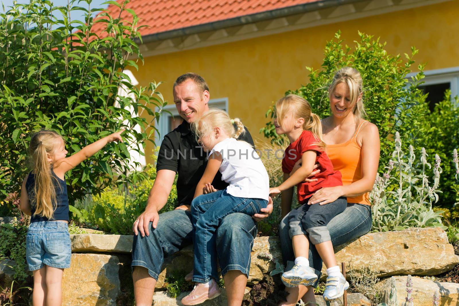 Family in front of home by Kzenon