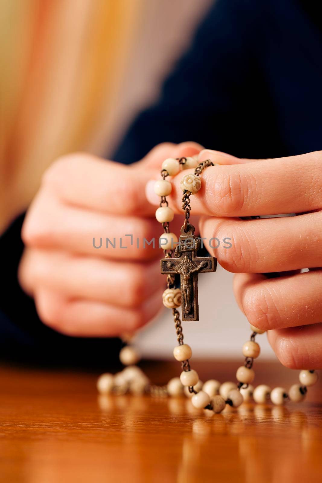 Woman praying with rosary to God by Kzenon