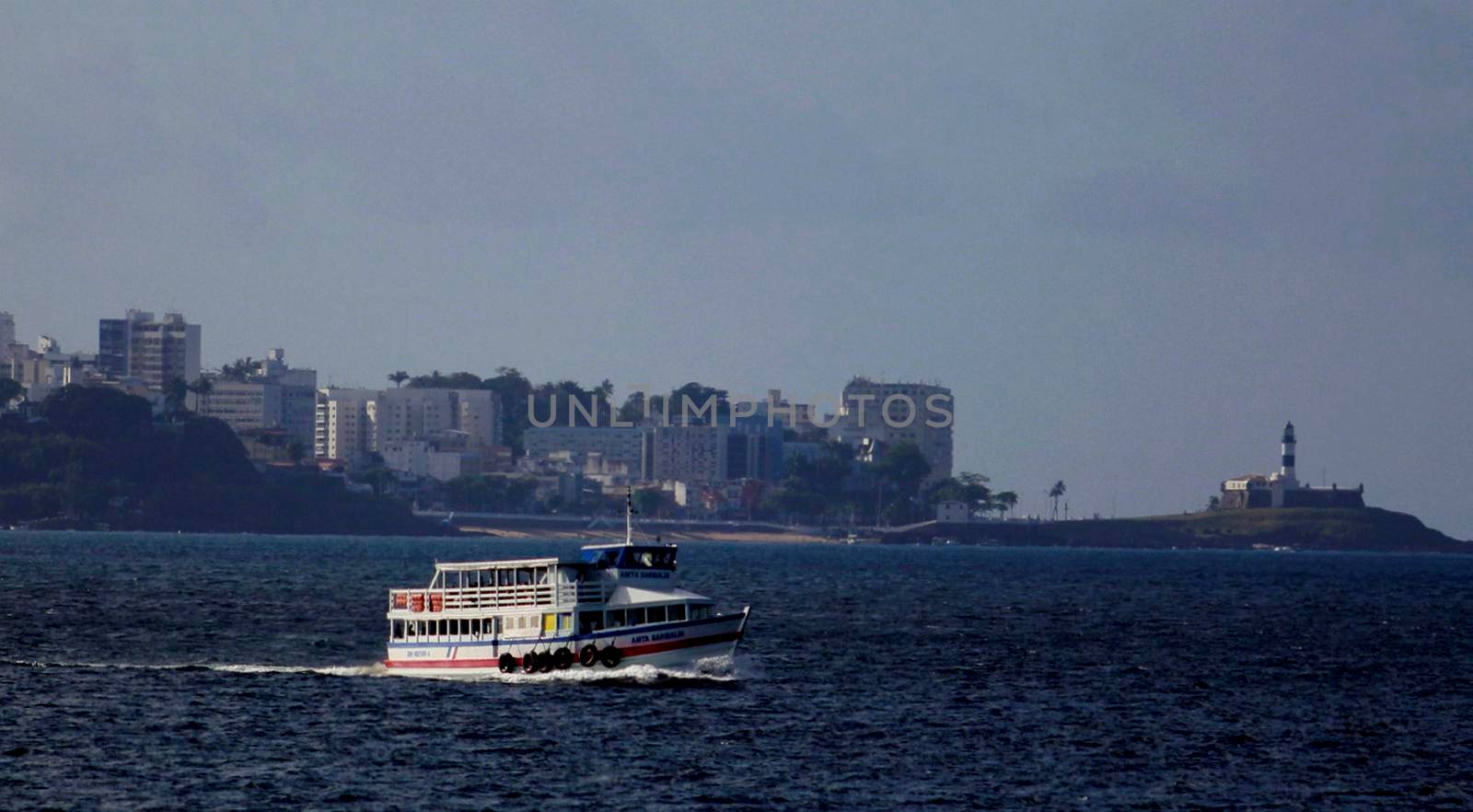 salvador, bahia / brazil - november 4, 2014: Speedboat crossing Salvador to Vera Cruz island, is seen sailing in Todos os Santos Bay.


 