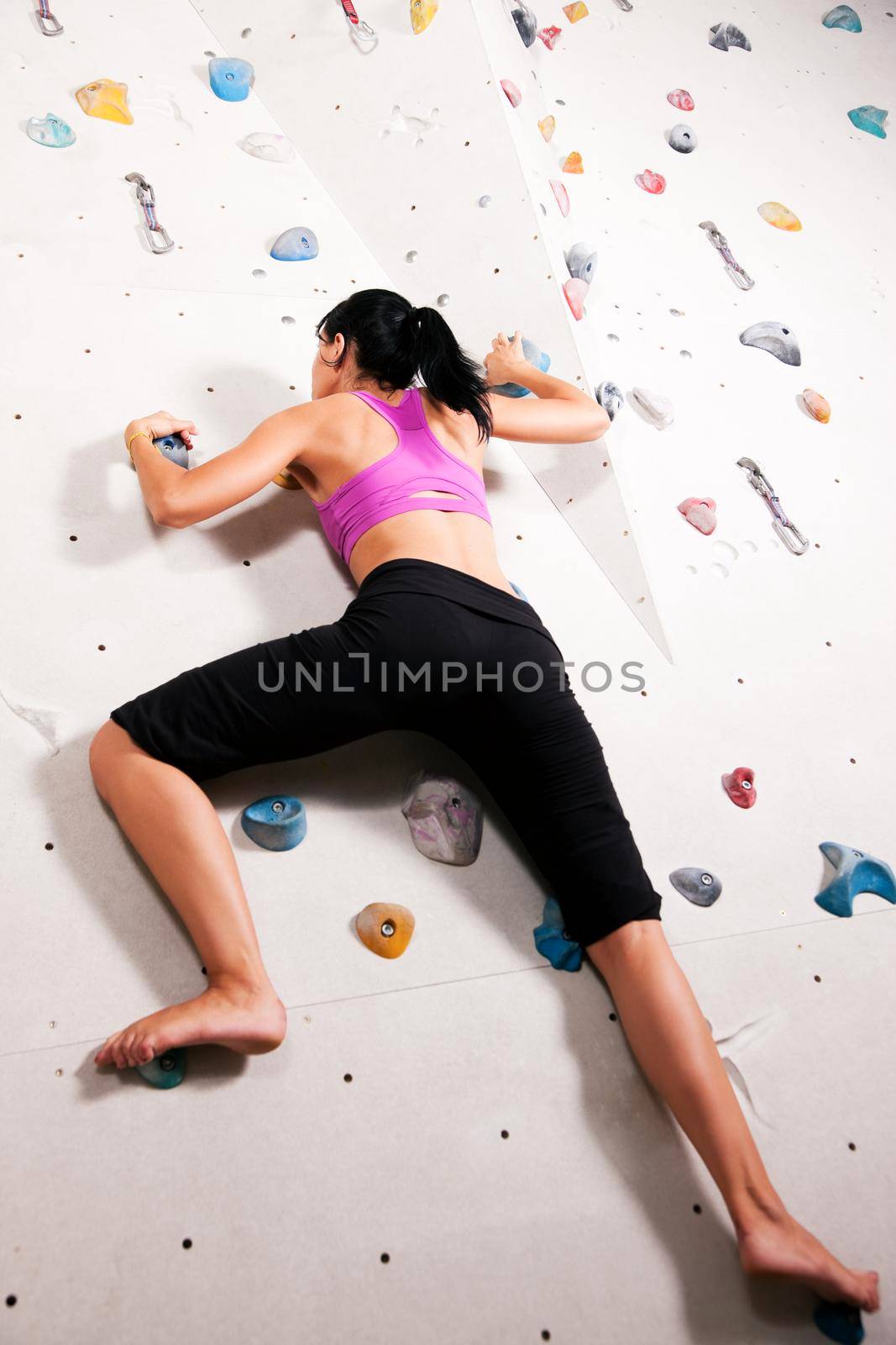 Woman at the climbing wall by Kzenon