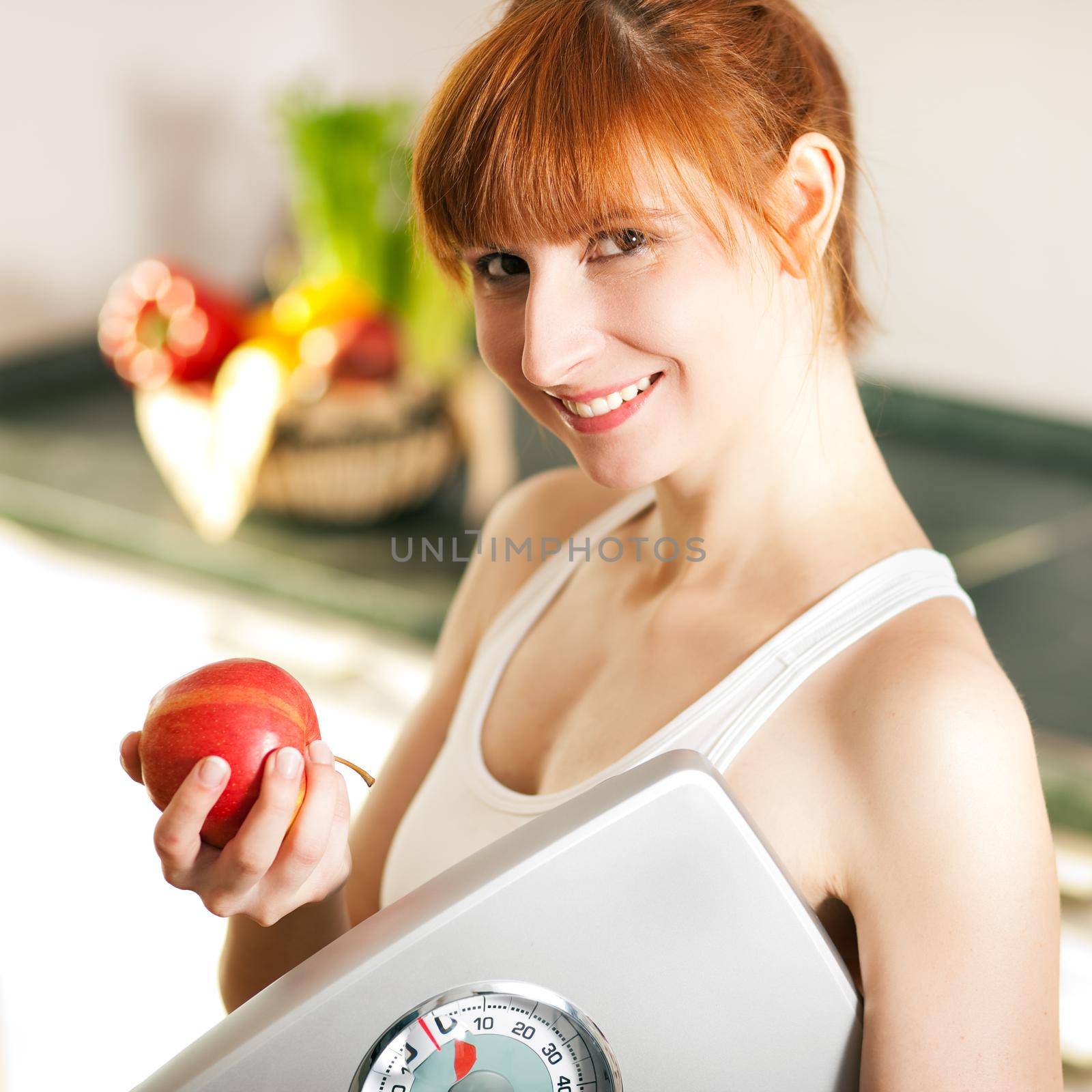 loosing weight - woman with scale and apple by Kzenon