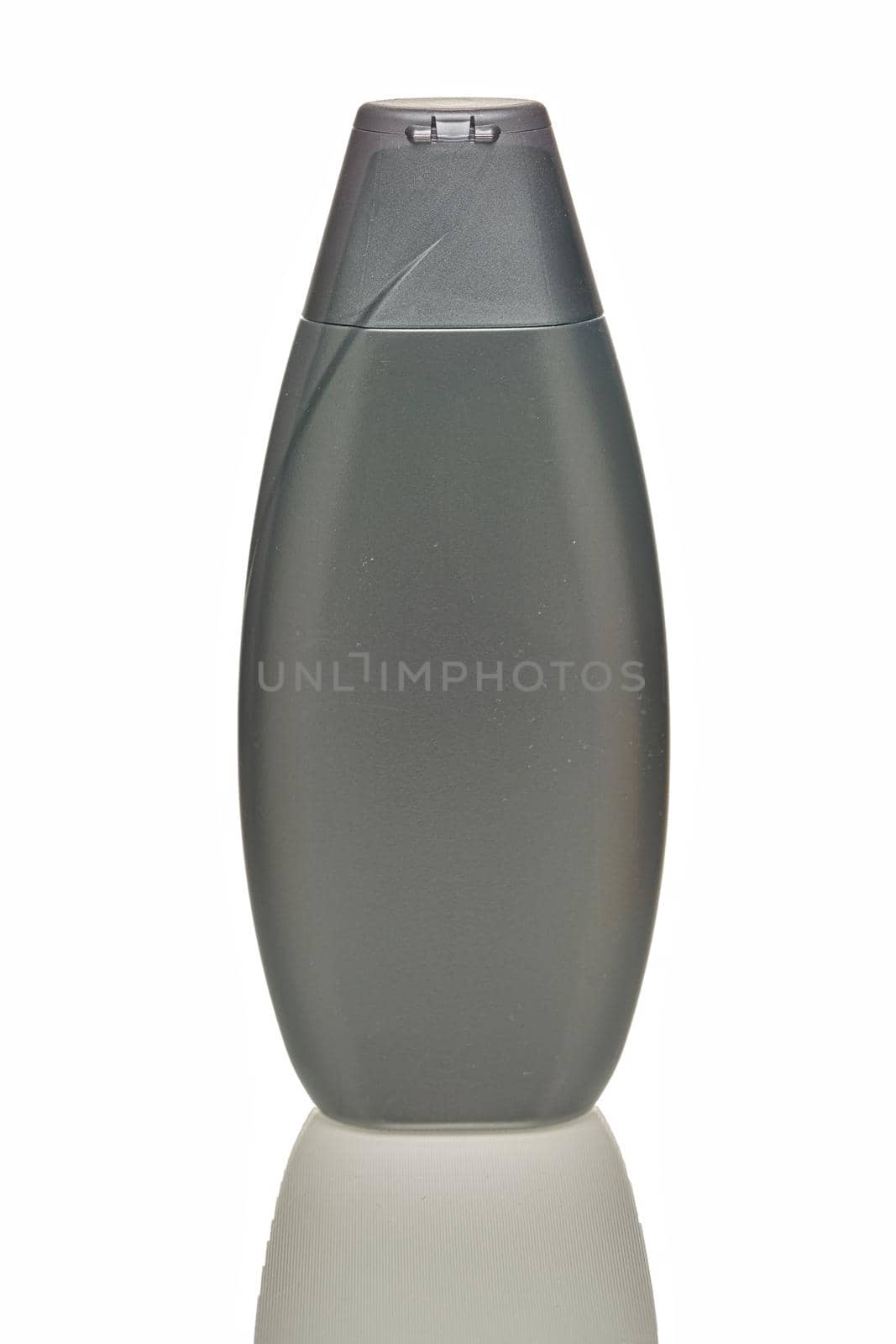 Gray plastic bottle on a white background, blank for design, place for text. Close up