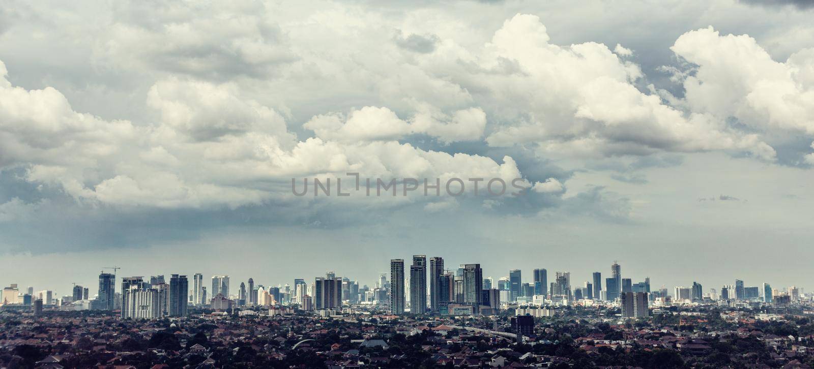 Jakarta city view with Kampung in foreground