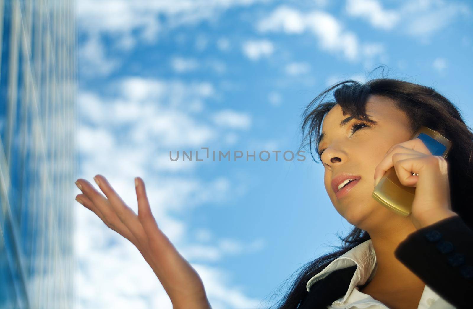 Brunette woman using her phone, gesturing