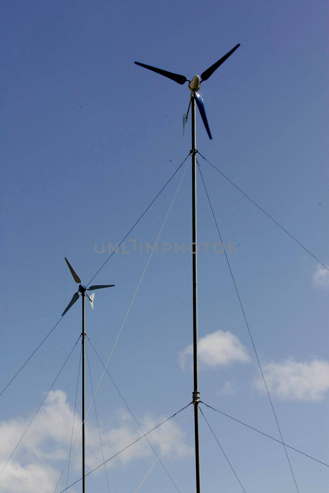 nova vicosa, bahia / brazil - setembro 8, 2009: small wind turbine used in a project to collect electricity for the community of Ilha da Cassumba, in Nova Vicosa.