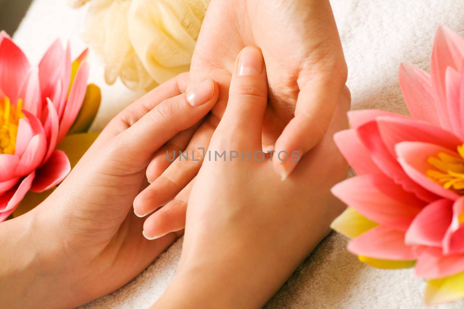 Woman getting a hand massage (close up on hands)