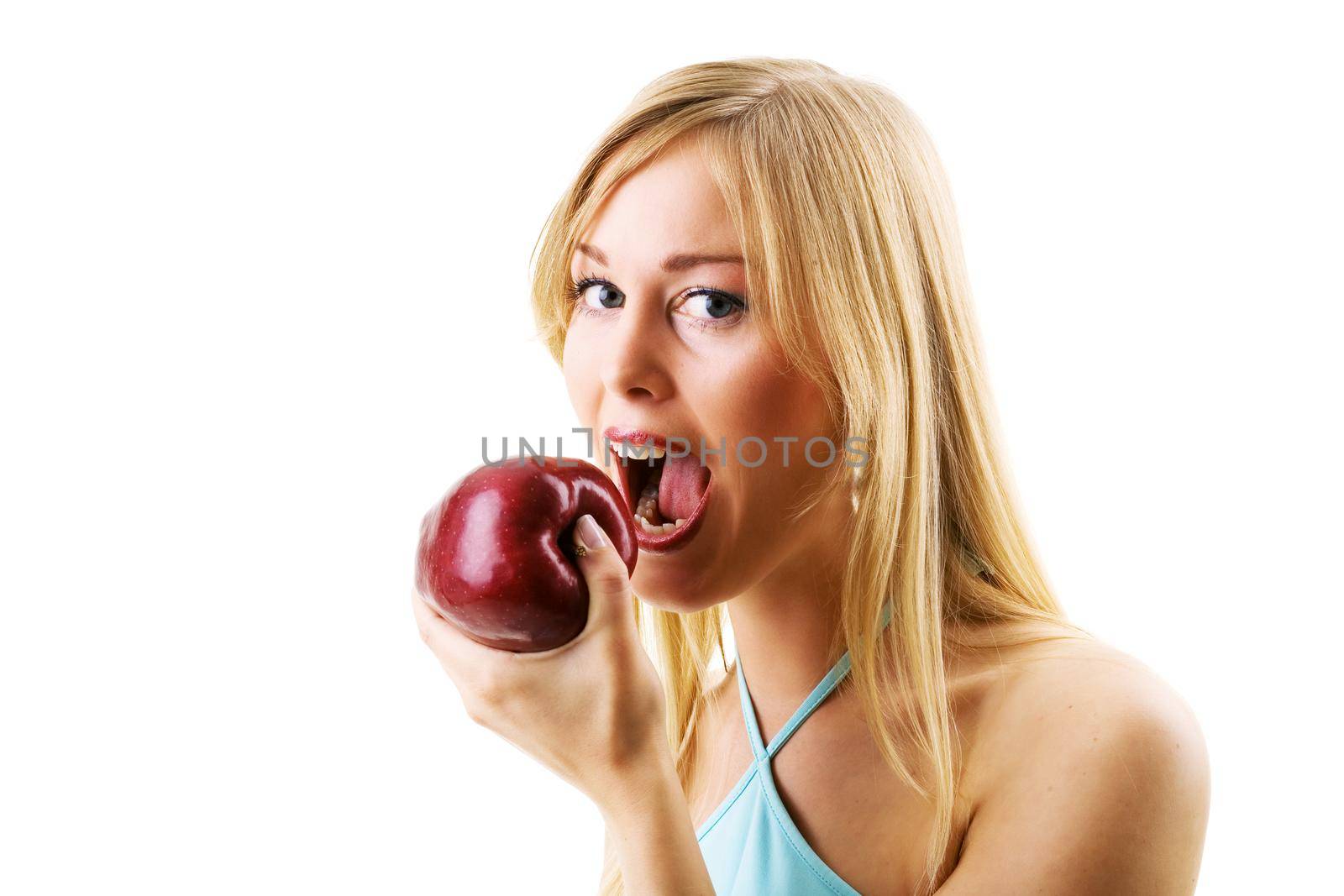 Blonde woman eating juicy apple by Kzenon
