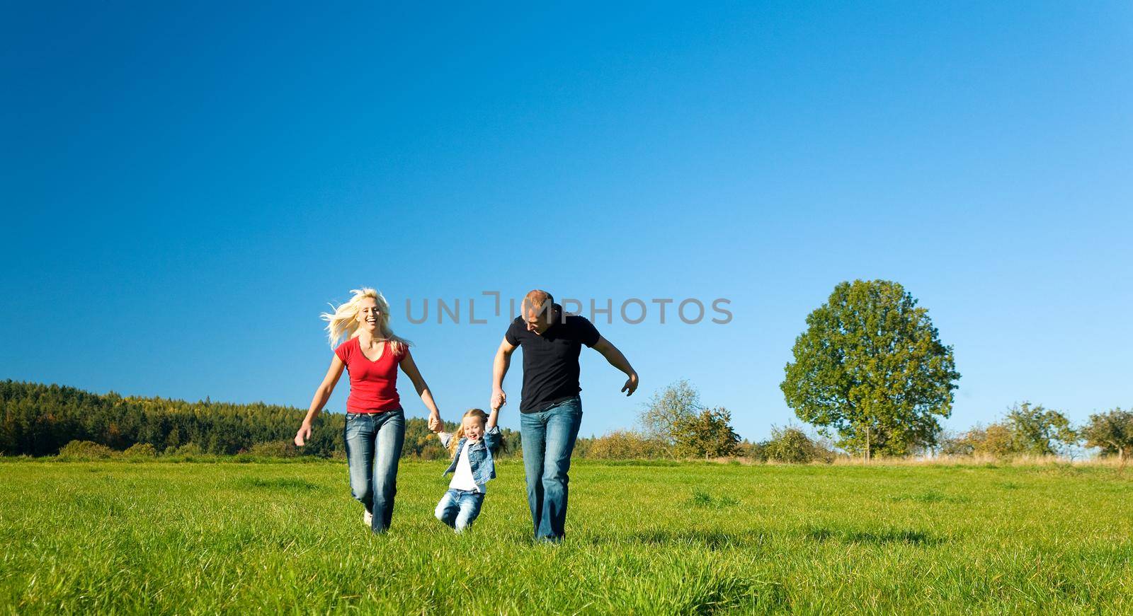 Family with her daughter in the outdoors