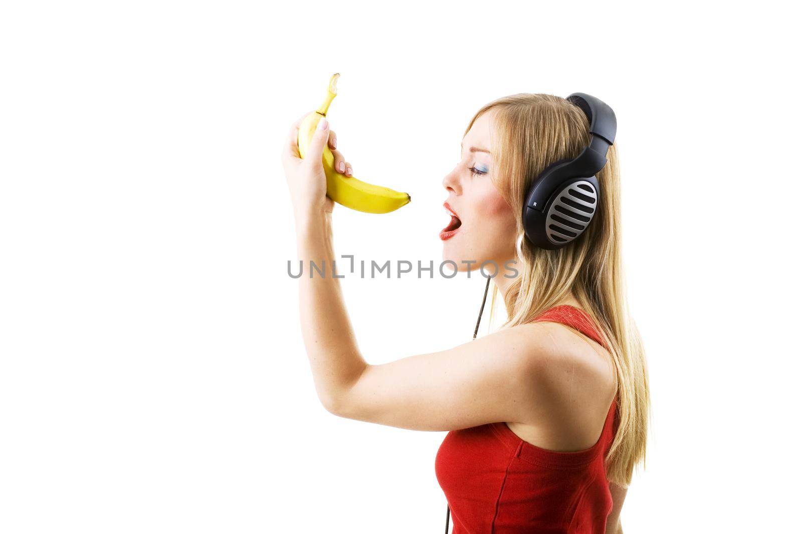 Woman singing into a banana