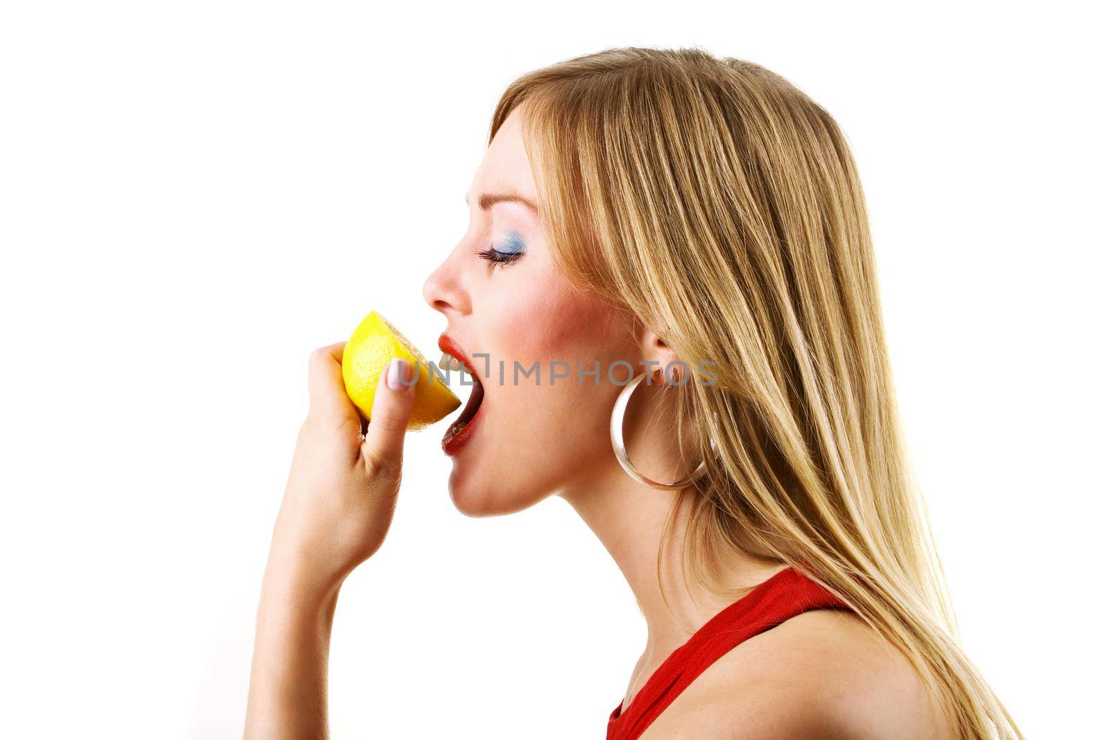 Woman eating lemon by Kzenon