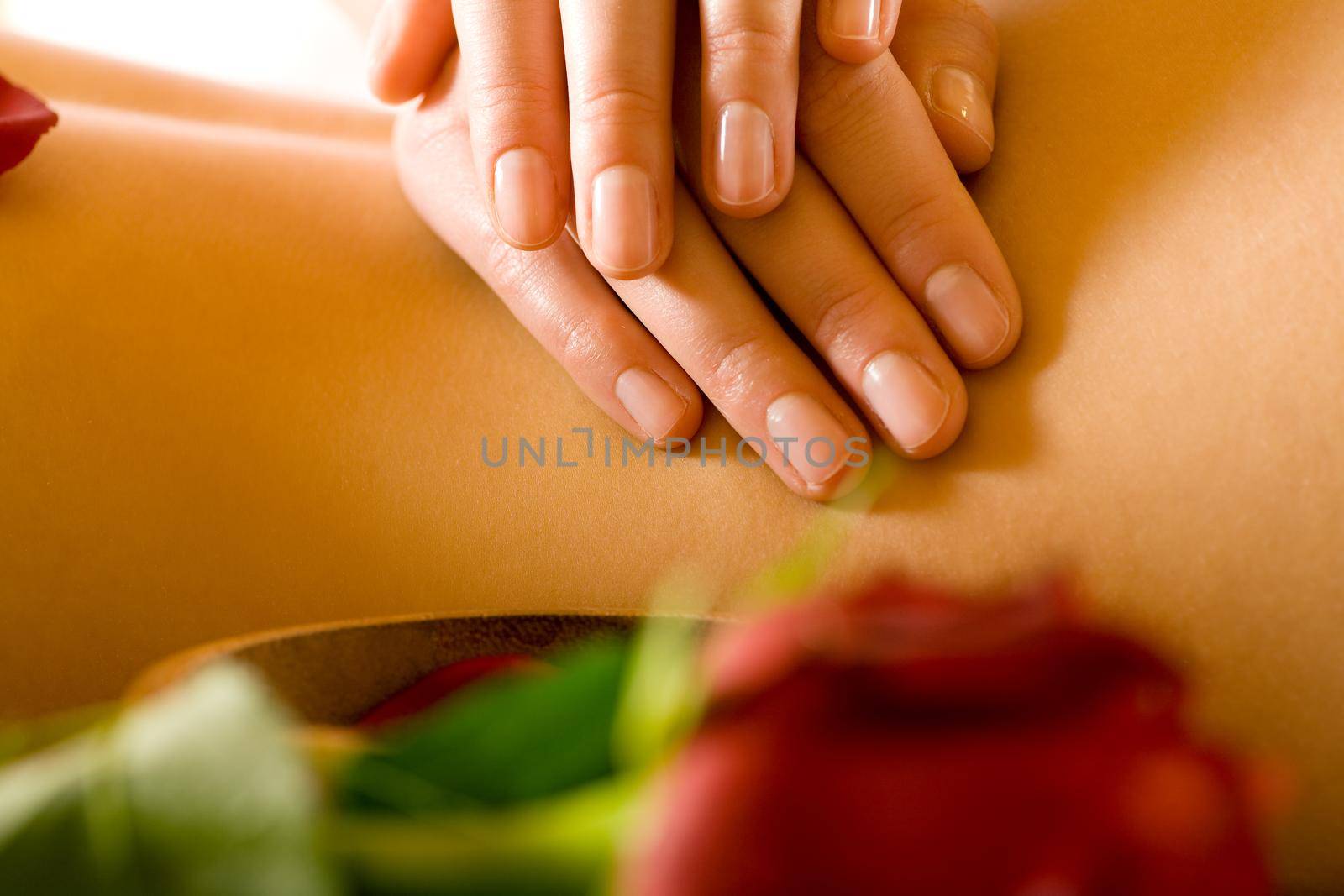 Woman enjoying a massage in a spa setting